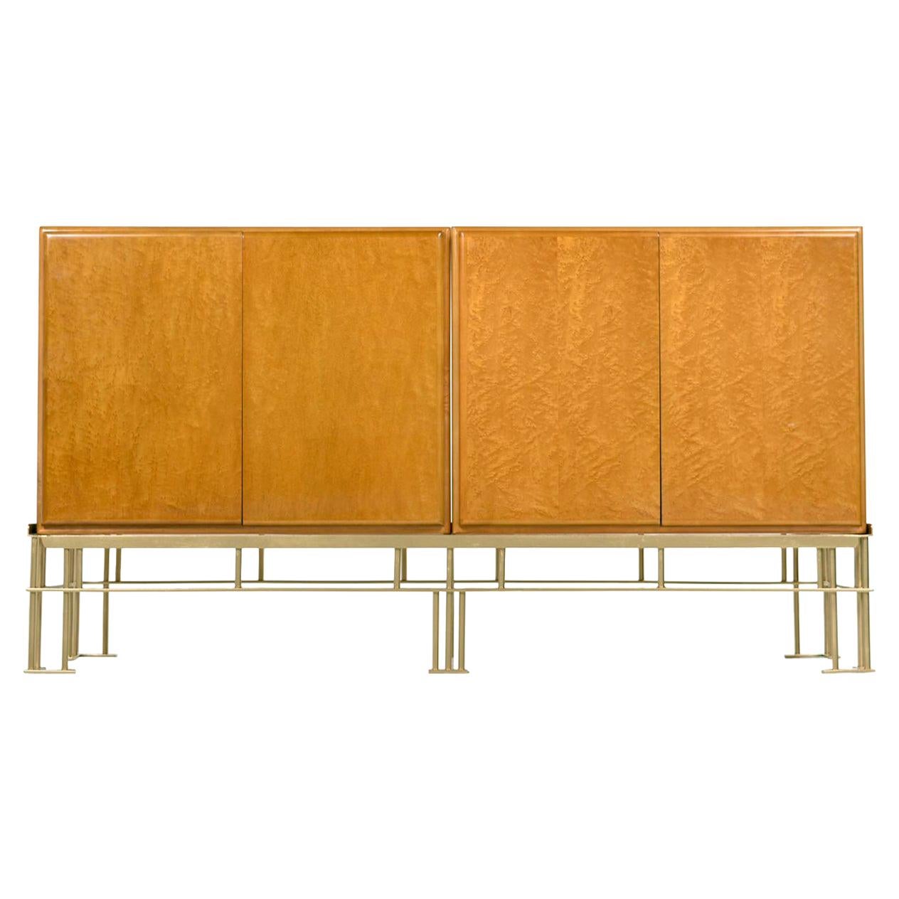 These iridescent lacquered solid bird's-eye maple wood cabinets are sure to make this piece the focal point of any room. Cabinets are removable from metal frame. One adjustable solid maple shelf in each cabinet. Cabinets (not base) Designed by Milo