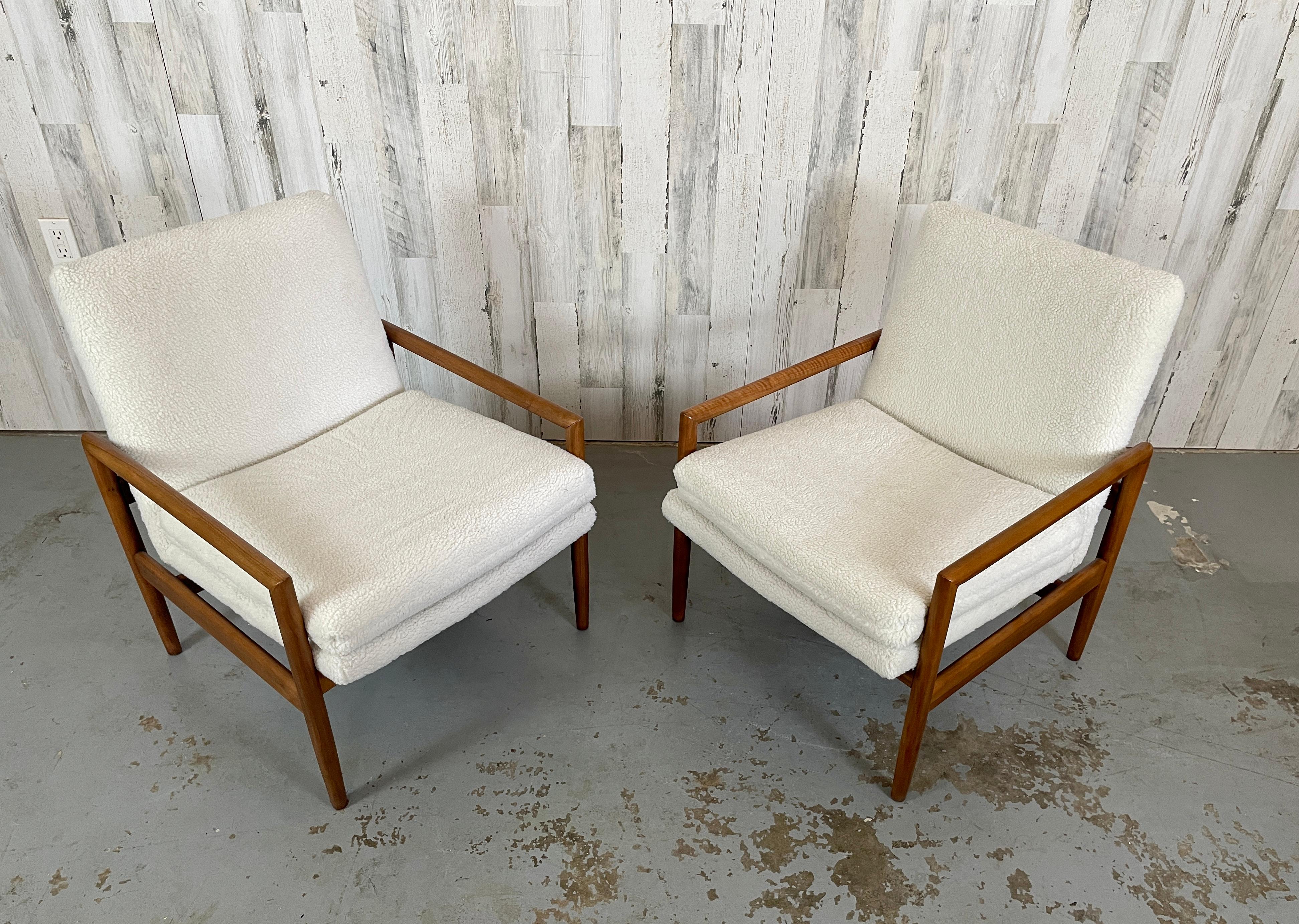 A very rare pair of Milo Baughman for Thayer Coggin lounge chairs. These are an earlier model that include the original labels. These chairs have been restored in a faux teddy bear ivory Sherpa fabric. Very modern and trendy. These are a true