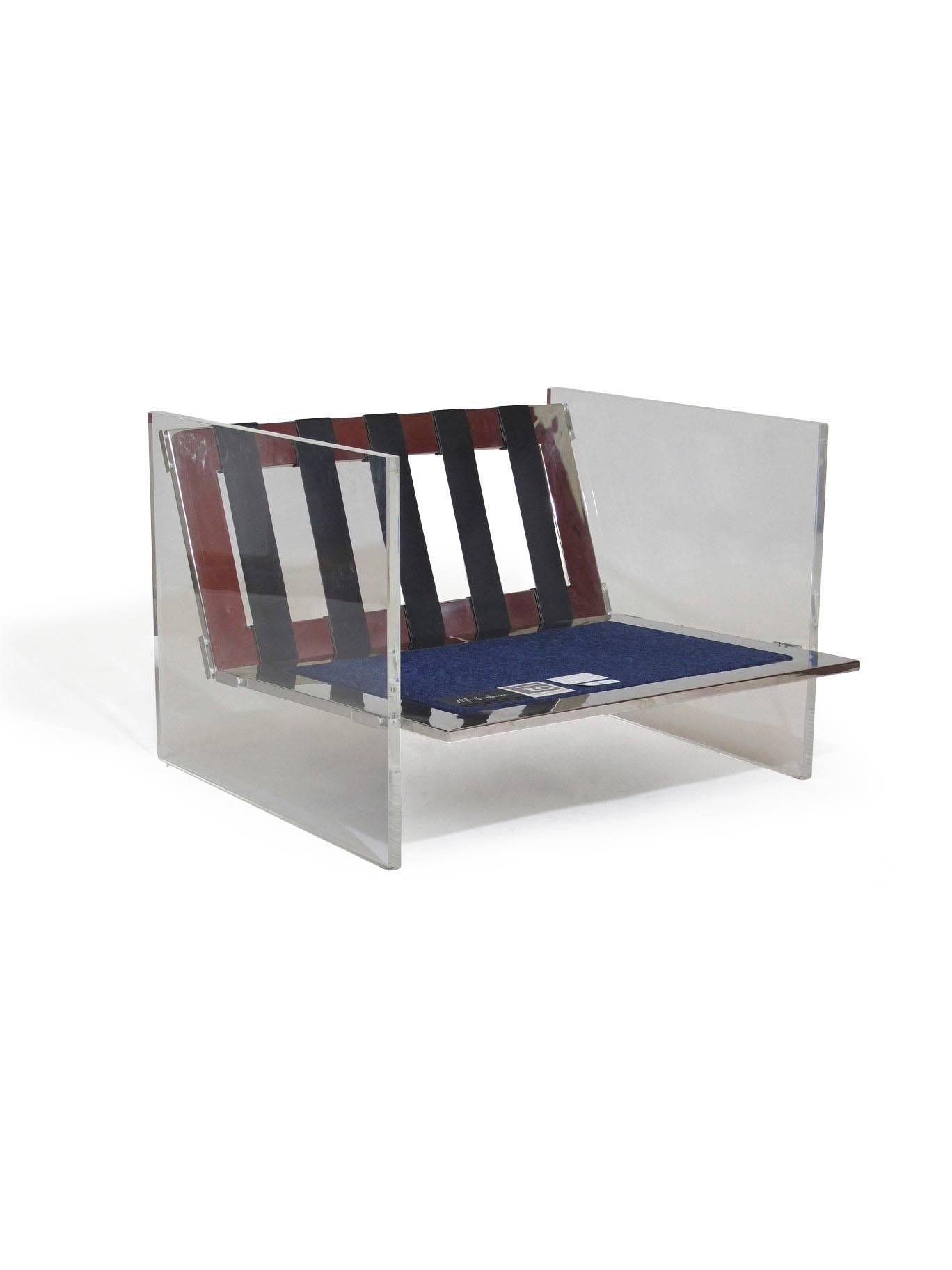 Lucite and chrome lounge chair designed by Milo Baughman for Thayer Coggin upholstered in navy blue chenille fabric. 
Features clear acrylic side panels on polished stainless frame with leather strapping. 
Custom COM options available upon request. 