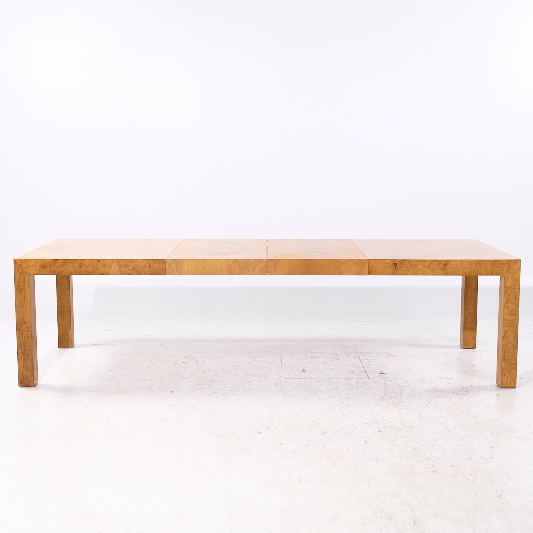 Milo Baughman for Thayer Coggin Mid Century Burlwood Dining Table with 2 Leaves

This table measures: 66 wide x 39 deep x 28.75 inches high, with a chair clearance of 25.25 inches, each leaf measures 22 inches wide, making a maximum table width of