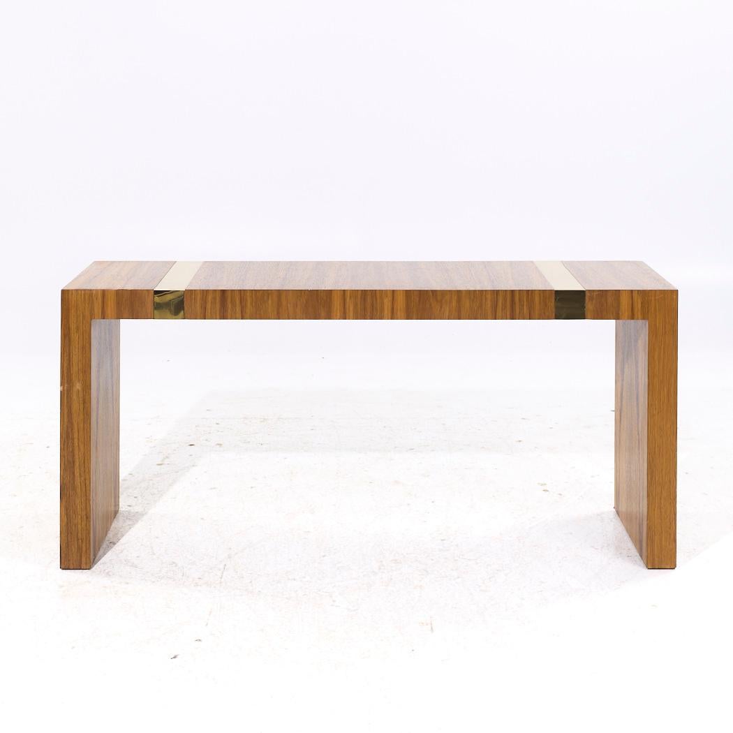 Milo Baughman for Thayer Coggin Mid Century Rosewood and Brass Console Table

This console table measures: 60 wide x 18 deep x 27 inches high

All pieces of furniture can be had in what we call restored vintage condition. That means the piece is