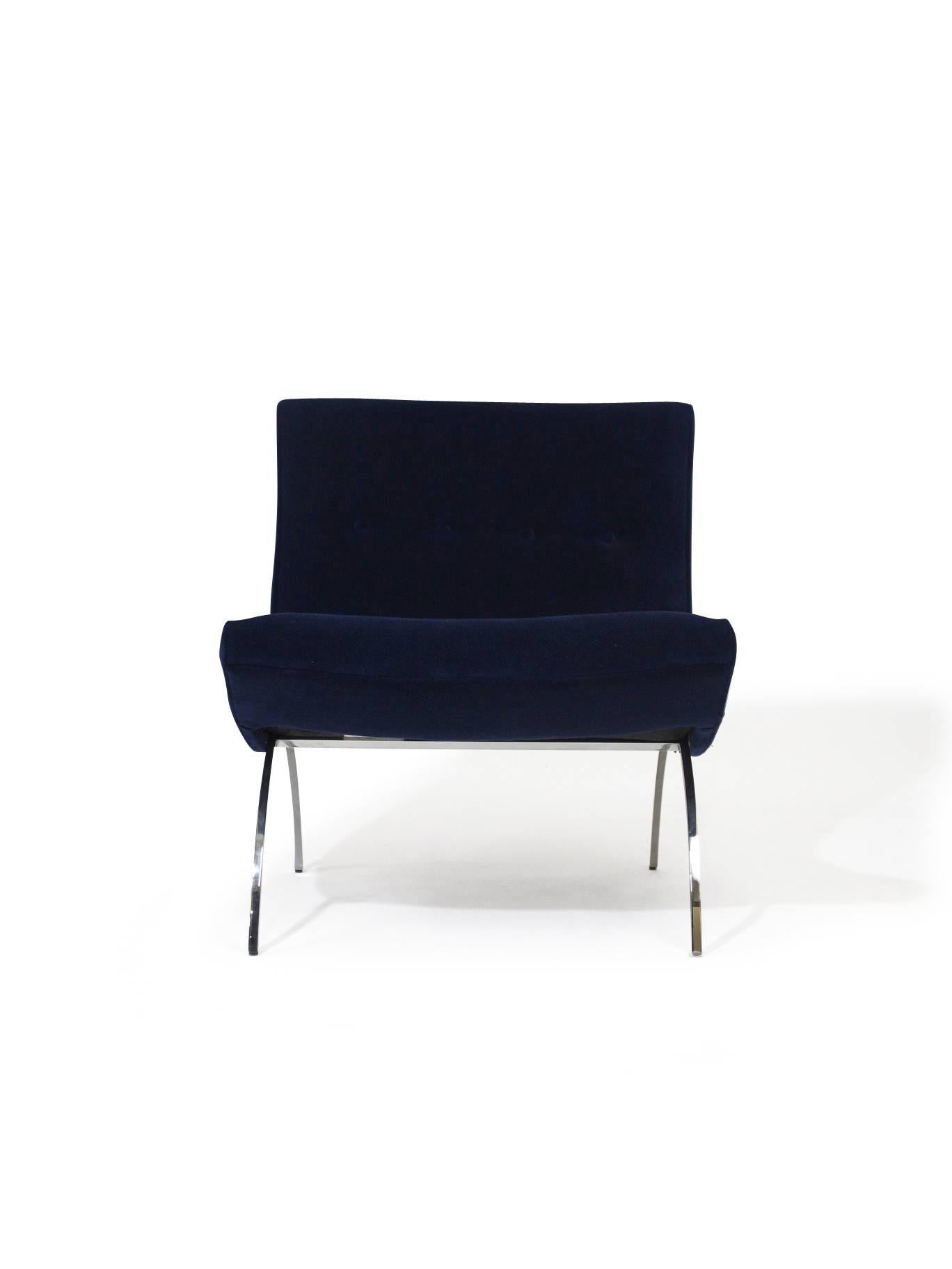 Midcentury designed scoop chair by Milo Baughman for Thayer Coggin lounge chair upholstered in navy velvet, raised on polished stainless steel arched legs.


