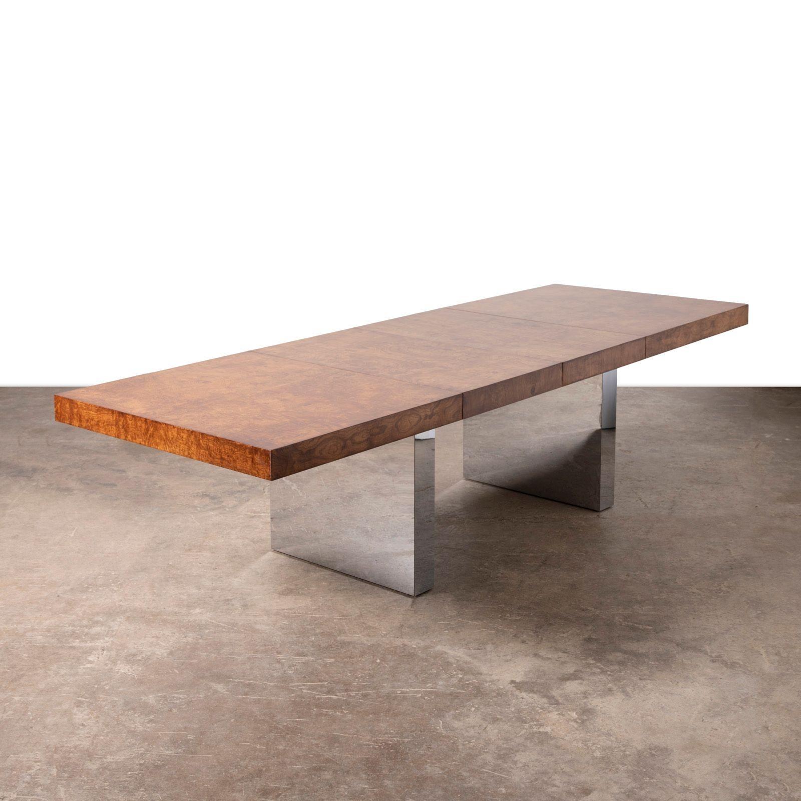 A showstopping blend of sophistication and modernist glamour, this rare dining table by Milo Baughman for Thayer Coggin (circa 1970s) makes a bold statement in any interior. The expansive top, crafted from richly grained olive burlwood, showcases