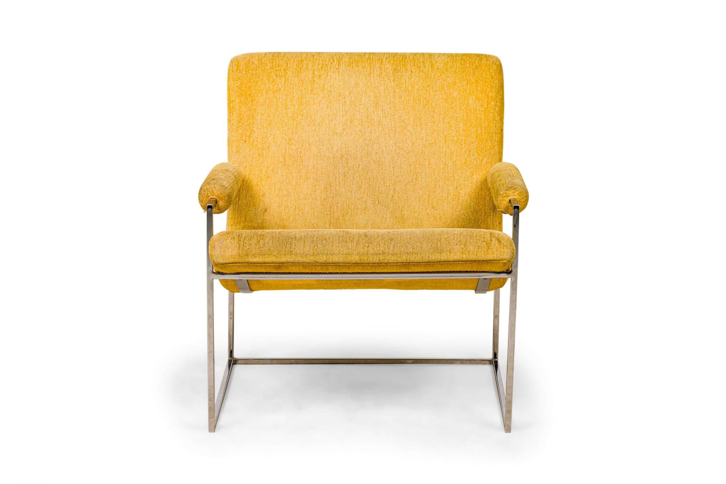 American Mid-Century scoop armchair with pale yellow velour upholstered seat, back, and arms with button tufted detail along the seam where the seat and back join, supported by a thin square tube chrome frame and legs. (MILO BAUGHMAN FOR THAYER