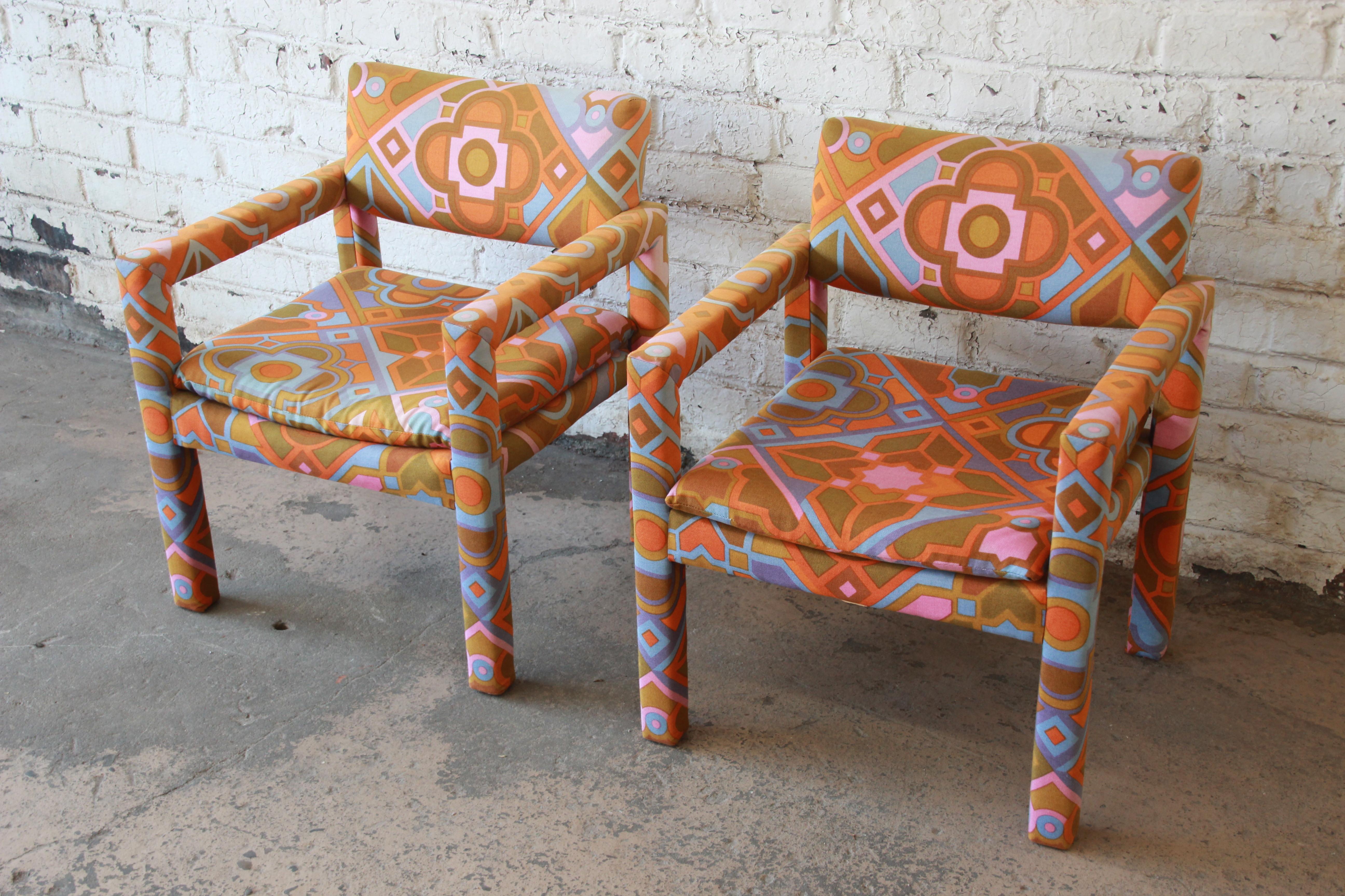 An exceptional pair of Parsons club chairs designed by Milo Baughman for Thayer Coggin. The chairs feature sleek mid-century modern design and outstanding Jack Lenor Larsen fabric. These are true statement pieces for any modern or Boho Chic