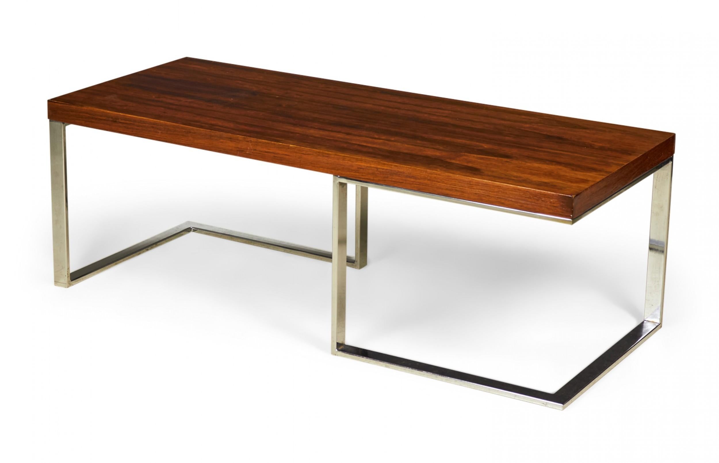 American Mid-Century (circa 1970) rectangular 'Minimalist' coffee table with a rosewood top supported on a chrome plated steel frame. (MILO BAUGHMAN FOR THAYER COGGIN)