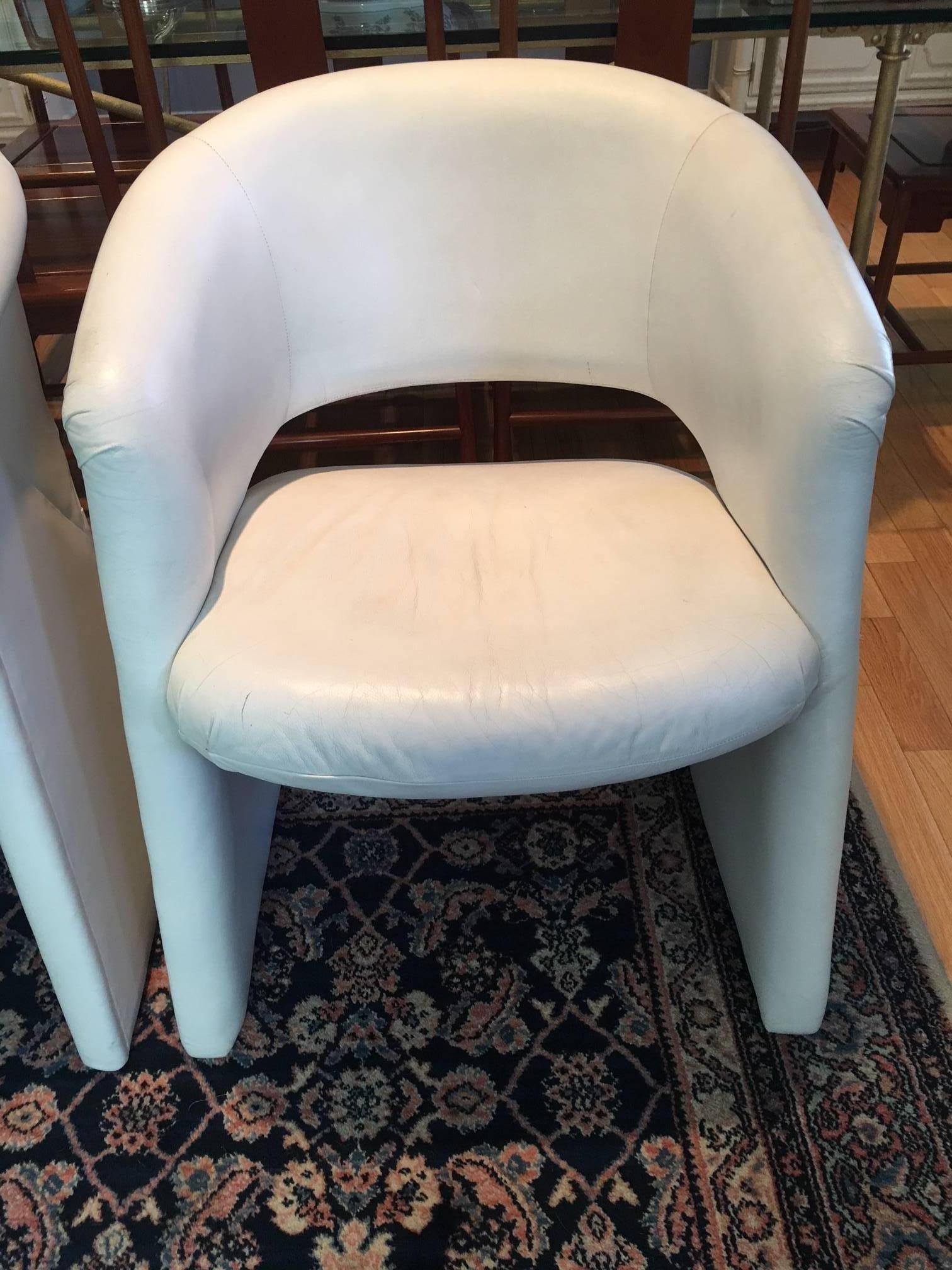 This vintage set is iconic. Upholstered in original white leather, the set is in great condition but with signs of age. The leather has been cleaned and conditioned and will be great to use as is for many more years. Or, you may reupholster if you