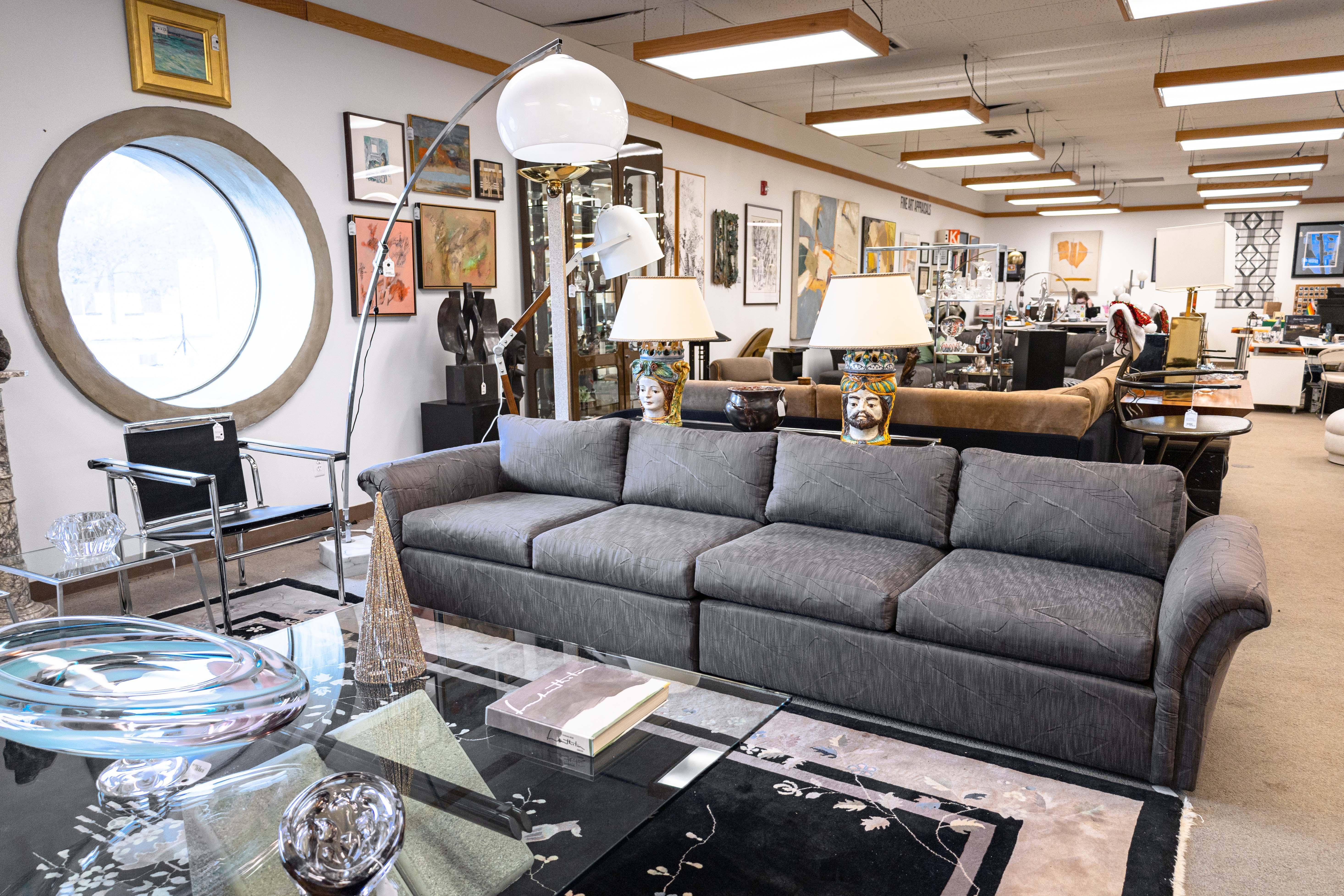 A Milo Baughman for Thayer Coggin slate sofa. This beautiful modern sofa features a lovely silhouette. It has a rectangular shape, wonderful sloping arms on either side, and a flat rectangular back. It features removable seat cushions and back