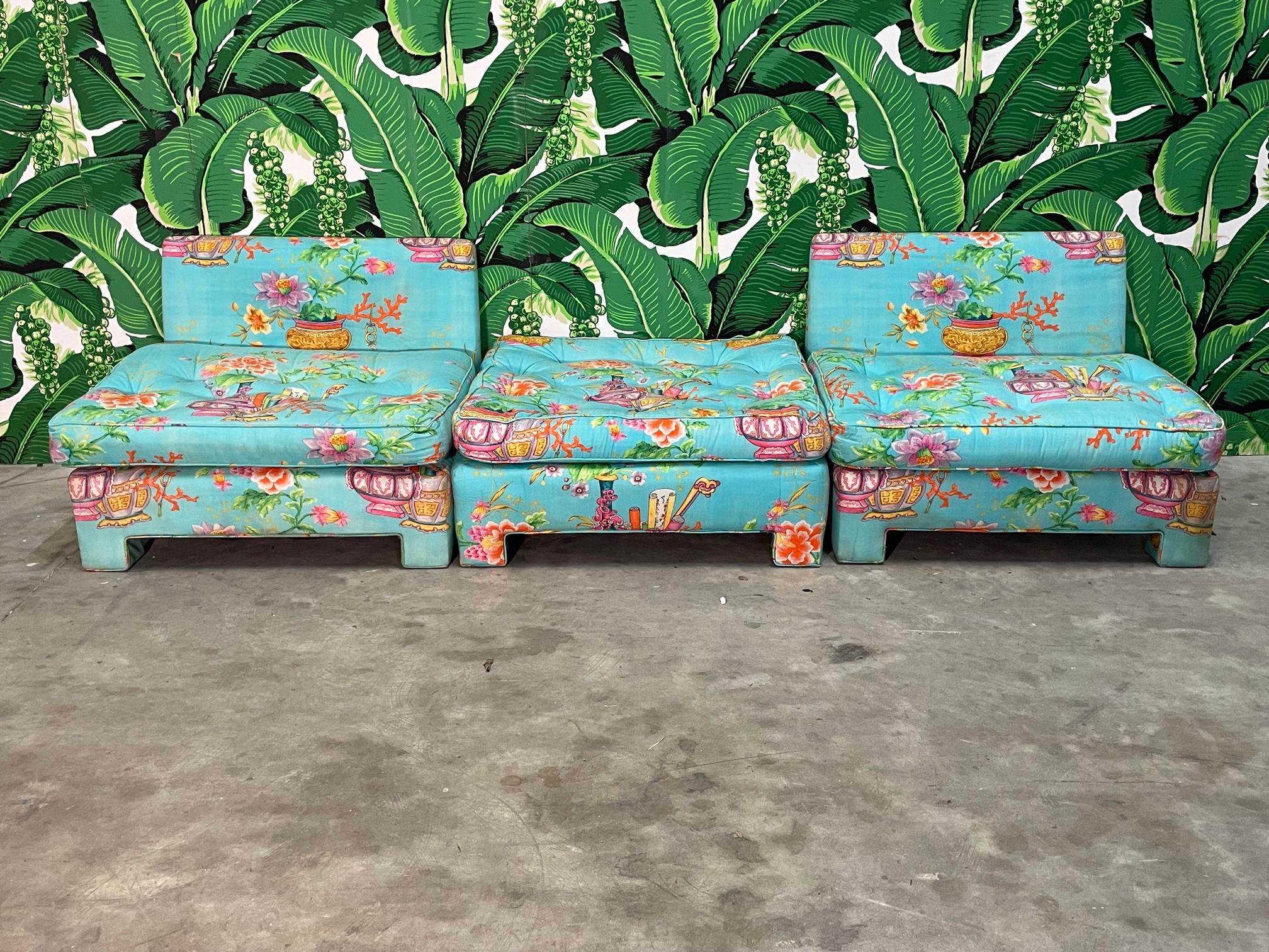 Chair and ottoman set by Milo Baughman for Thayer Coggin features two chairs and a single ottoman fully upholstered in a colorful, chinoiserie style print. This modular sectional set can be configured in several ways. Good condition with