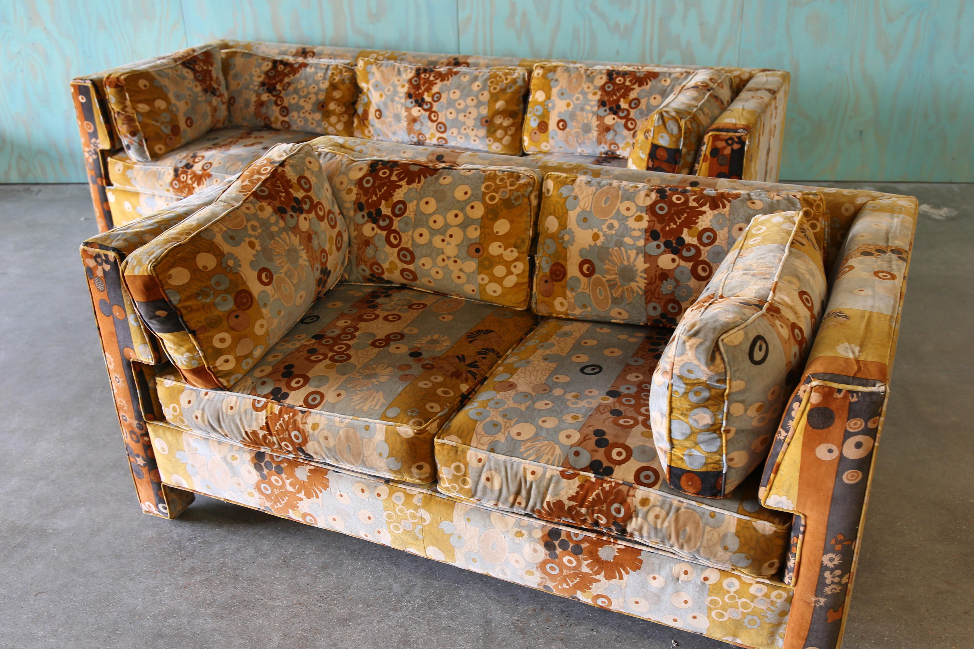 A matching set, sofa and loveseat designed by Milo Baughman for Thayer Coggin in original Jack Lenor Larsen Primavera fabric.  The channeled and flared arms hug the seat cushions. Evan arm tuxedo style with low backs.   A great velvet fabric in