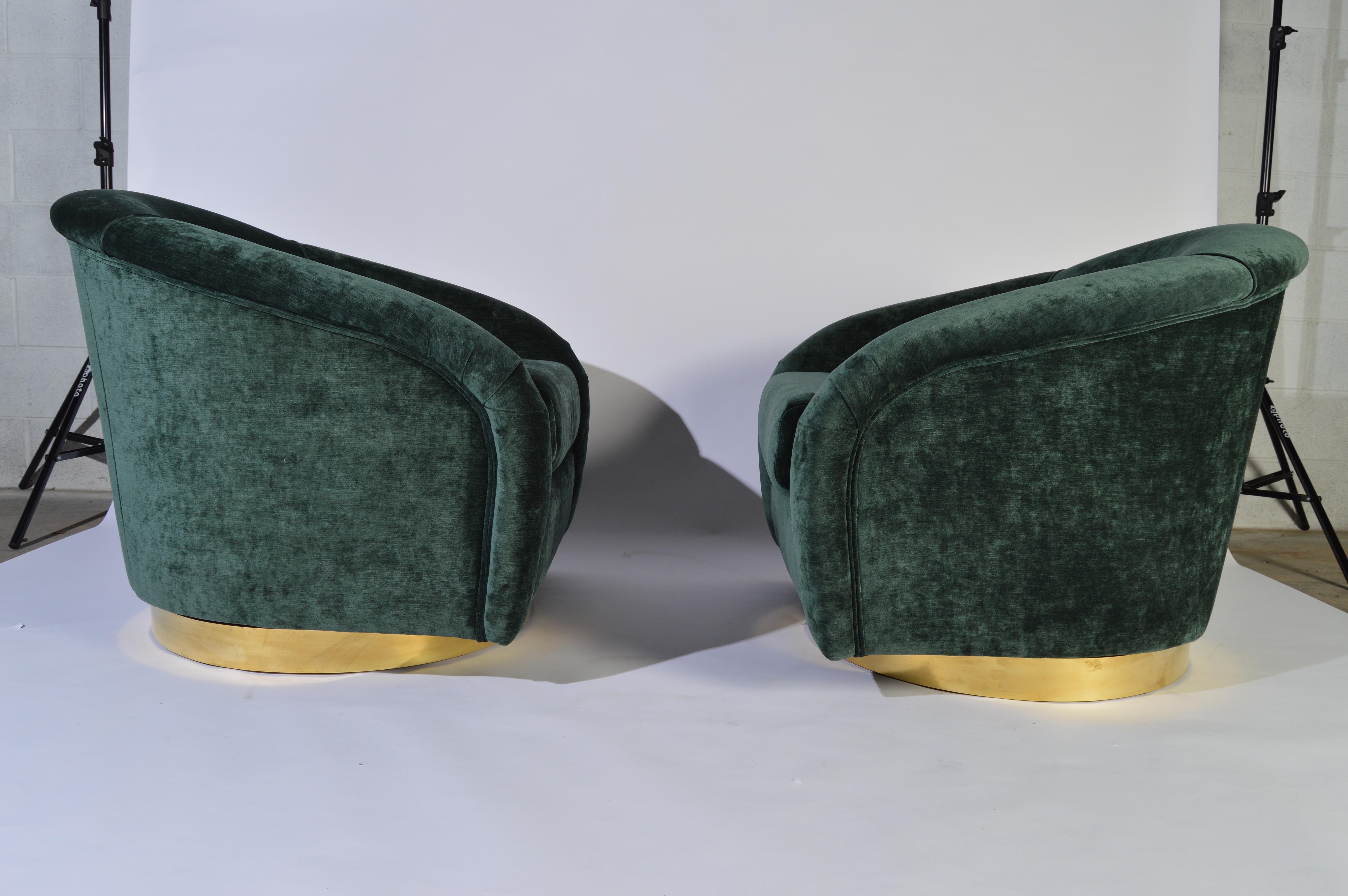 Jay Spectre swiveling club chairs in luscious green velvet with solid sheet brass bases circa 1980.
Stunning condition having fresh velvet upholstery and new cushioning.