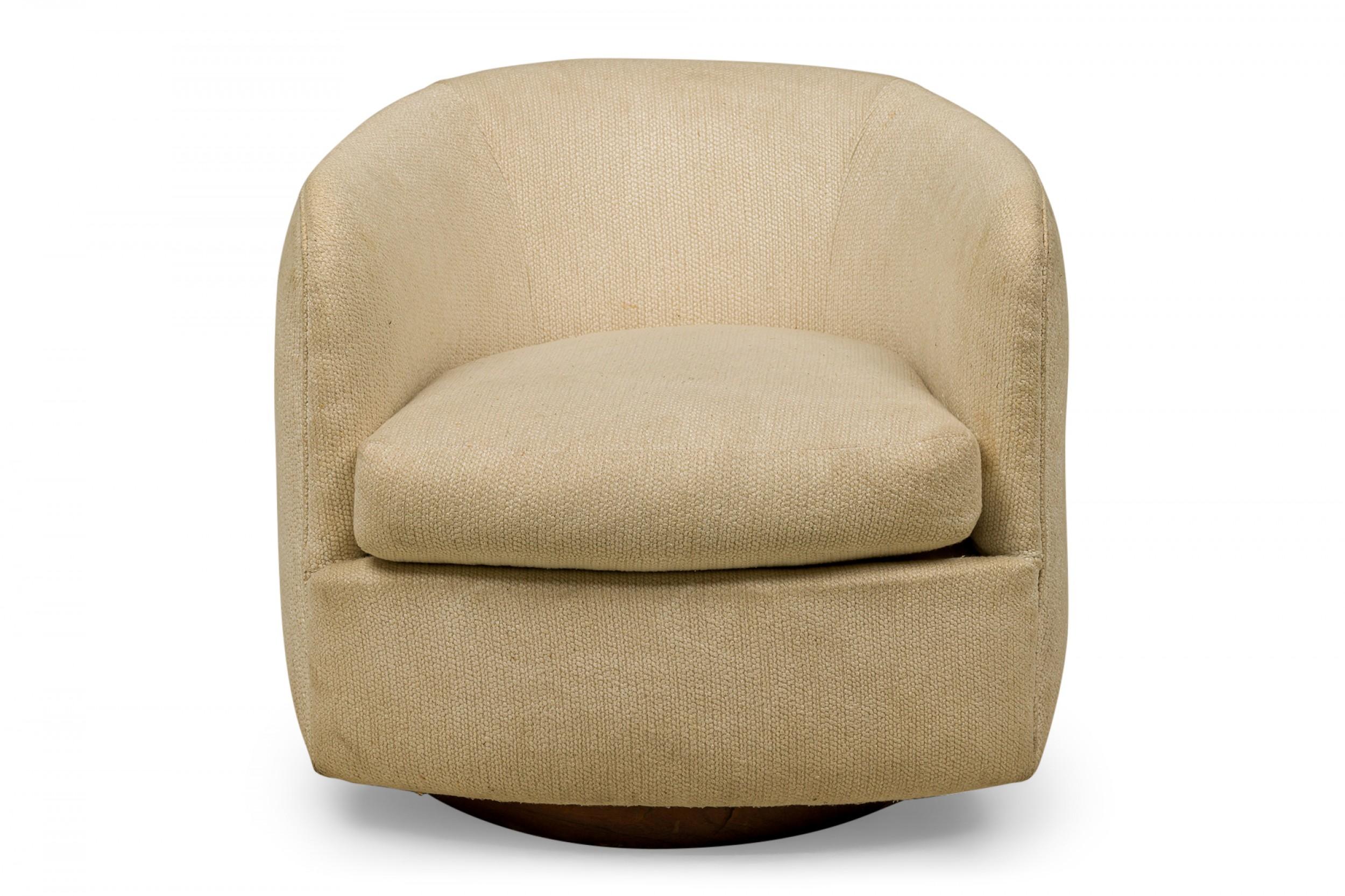 American mid-century horseshoe-form lounge / armchair with off-white fabric upholstery and a removable seat cushion. (Milo Baughman for Thayer Coggin).