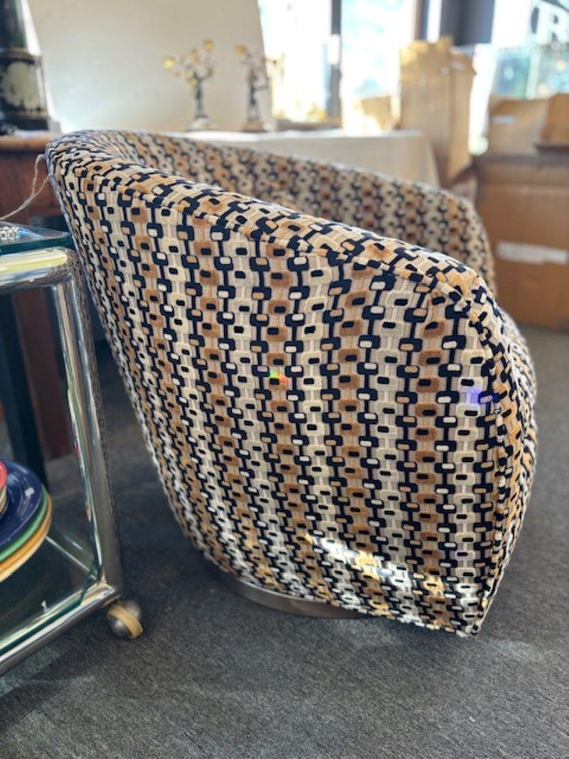 An eye-popping geometric swivel chair designed by Milo Baughman for Thayer Coggin. The chair is extremely comfortable and the upholstery is fine and soft. Original upholstery with tags.