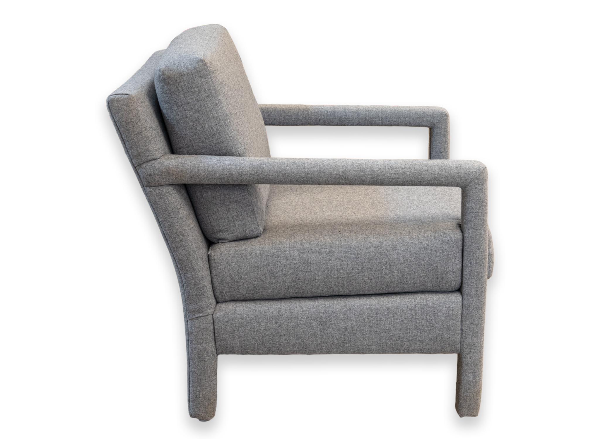 A Milo Baughman parsons accent chair. A beautiful upholstered accent chair with a head to toe grey/blue ultra soft fabric. This piece has removable cushions on the back and the seat. This piece is in very good condition. It measures 31 in tall, 27.5
