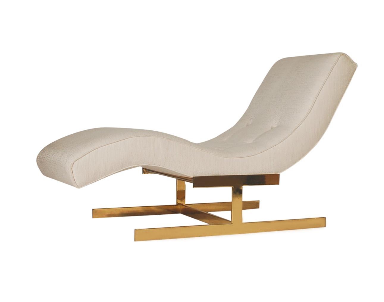 A sleek and glamorous design by Milo Baughman for Thayer Coggin. This chaise lounge features its original white upholstery with a brass flat bar base.