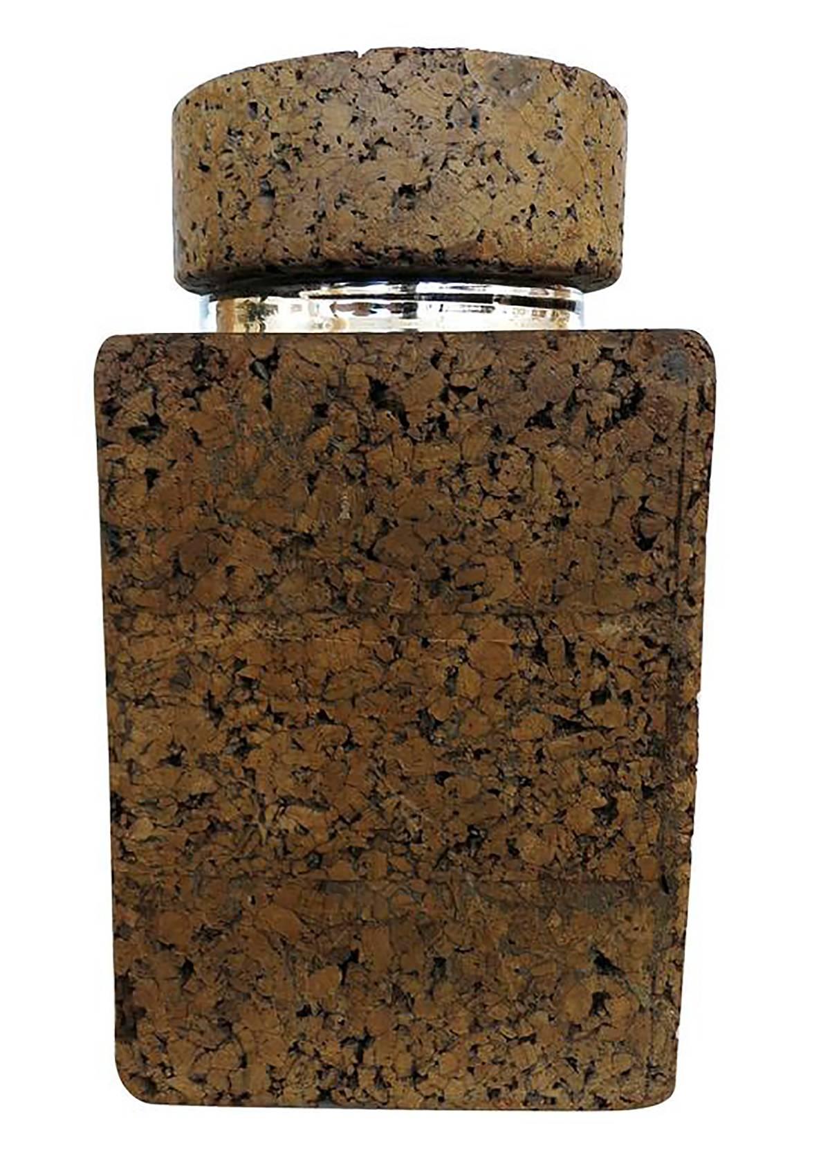 Large Mid-century oversized cork jar largely inspired by the works of Milo Baughman and Paul Frankl.

This large square shaped jar features a large piece of sculpted cork with a mirrored glass cylinder in the centre. Comes with original cork lid.