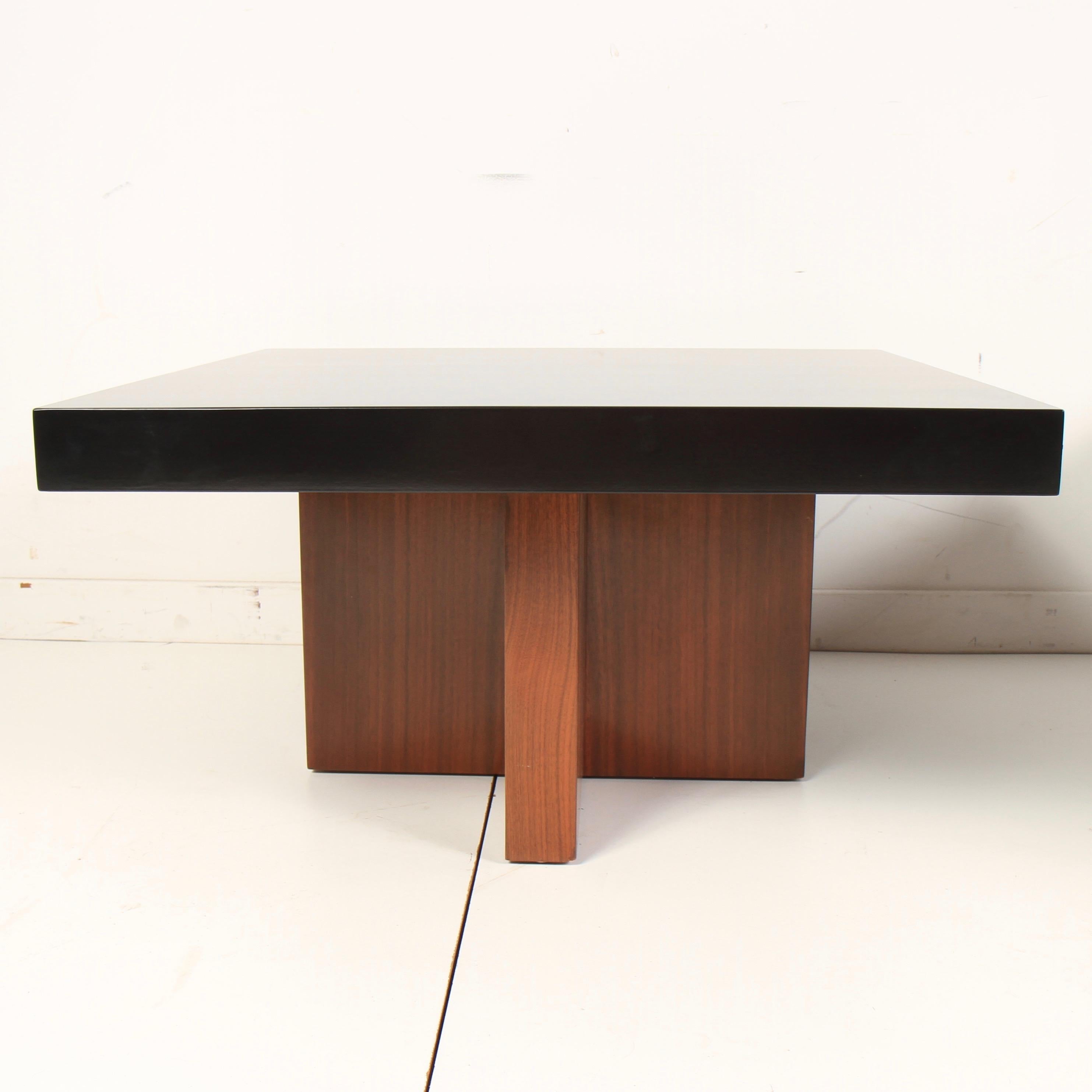 Pair of X-based walnut end tables, designed by Milo Baughman for Thayer Coggin, circa 1960s. The tops have been lacquered in a great contrasting ebony. Tables can be used as end or side tables, or pushed together as a coffee table.