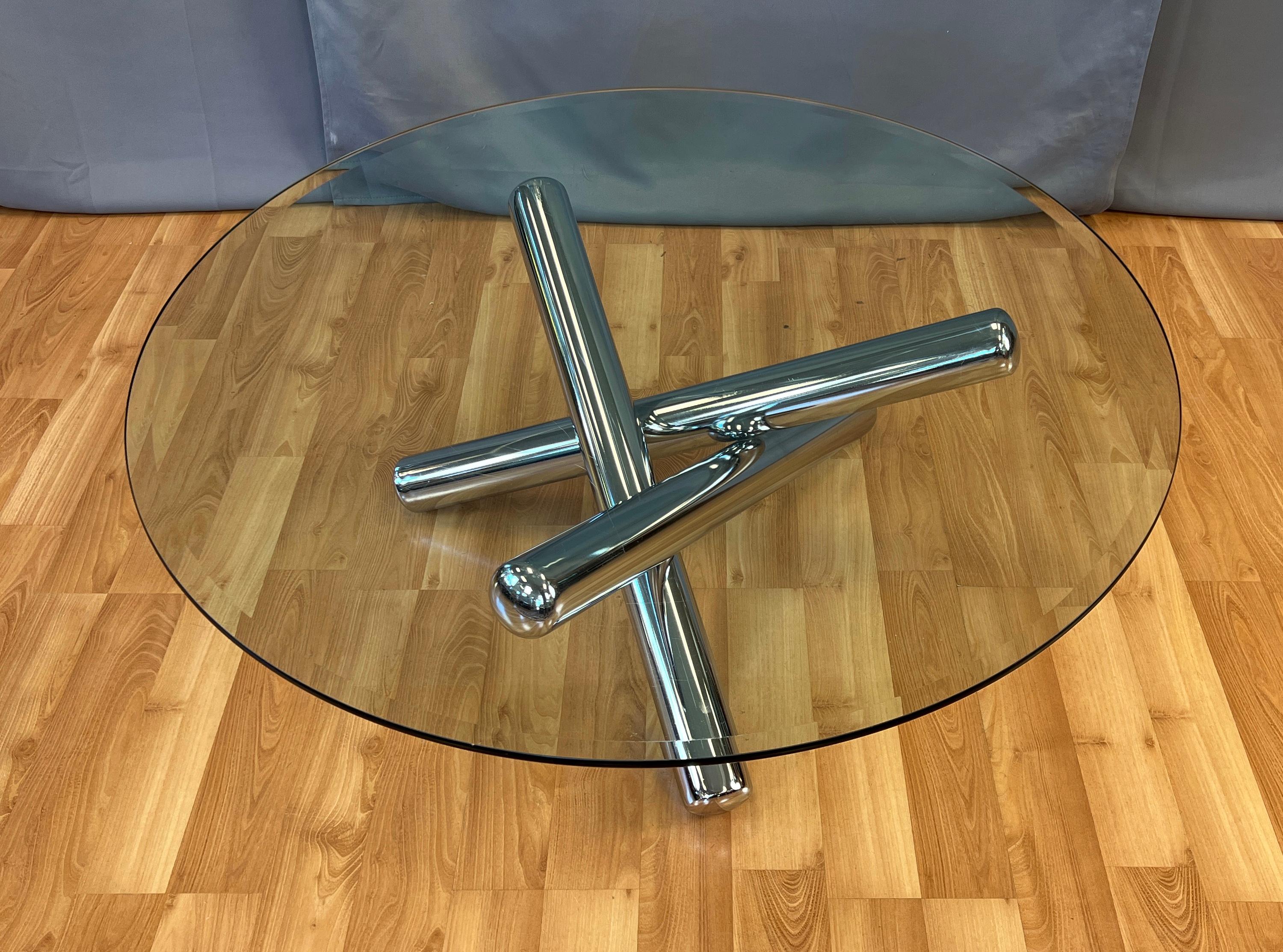 A vintage 1970s Milo Baughman designed large round glass top and chrome tube base 