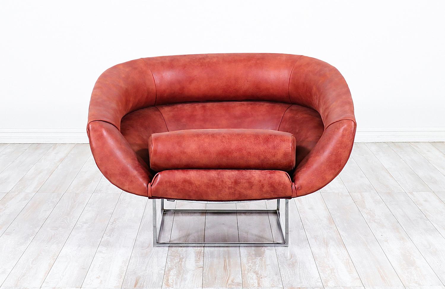 Mid-Century Modern tub chair designed by Milo Baughman for Thayer Coggin in the United States, circa 1970s. This comfortable, unique design features a reupholstered leather seat in a distressed red tone that contrasts nicely with the polished