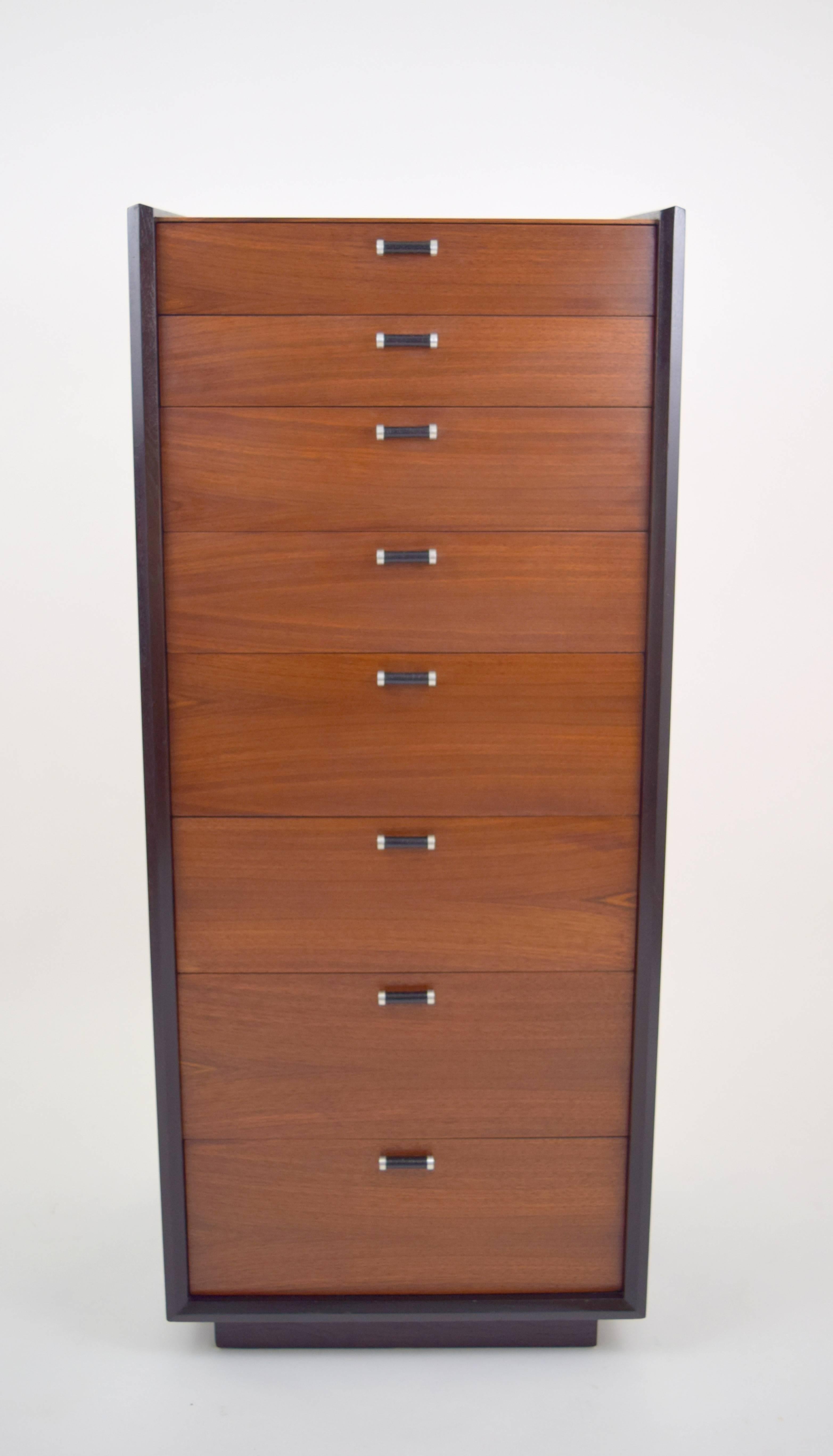 Amazing Milo Baughman lingerie chest for Glenn of California. Walnut drawers and top surface, with java stained case resting on inset plinth base. Angle and beveled case offset by eight beautiful walnut grained drawers and leather wrapped aluminum