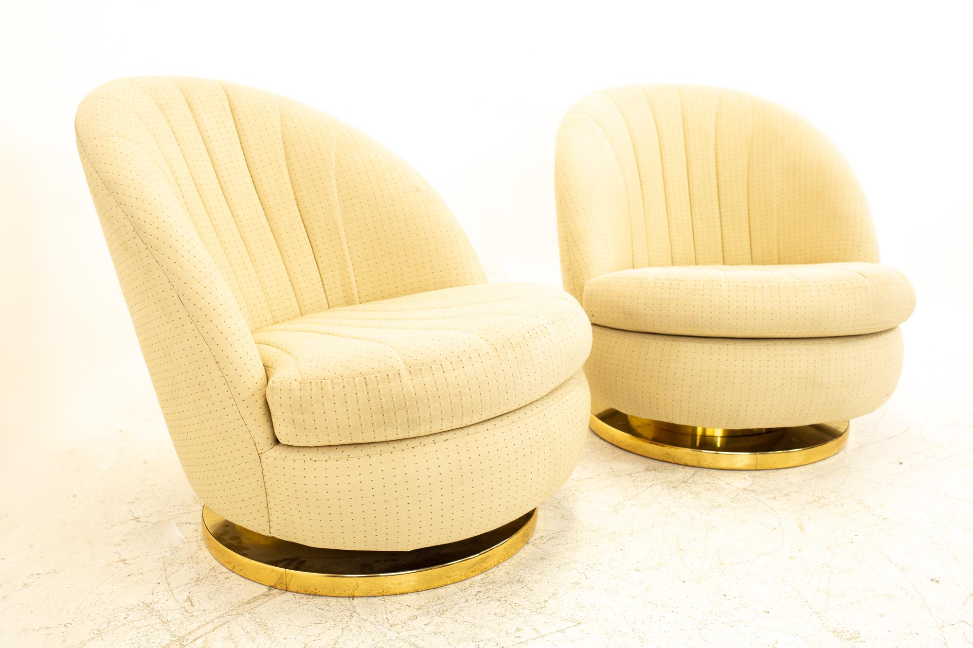 Milo Baughman mid century brass base swivel barrel lounge chairs, pair

Each chair measures: 28.5 wide x 33.5 deep x 30.5 high.
