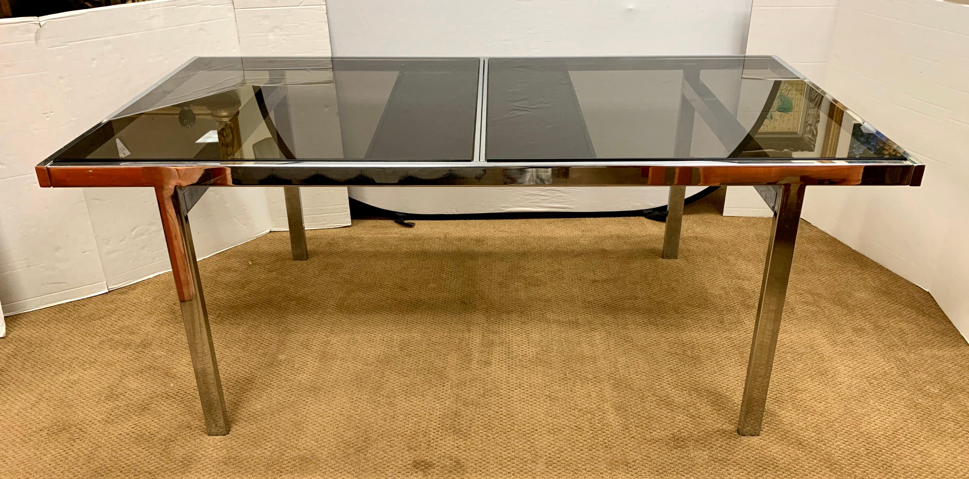 Elegant Milo Baughman Classic expandable glass and chrome table with hidden, attached leaf embedded in table. When table has leaf opened it expands to 94