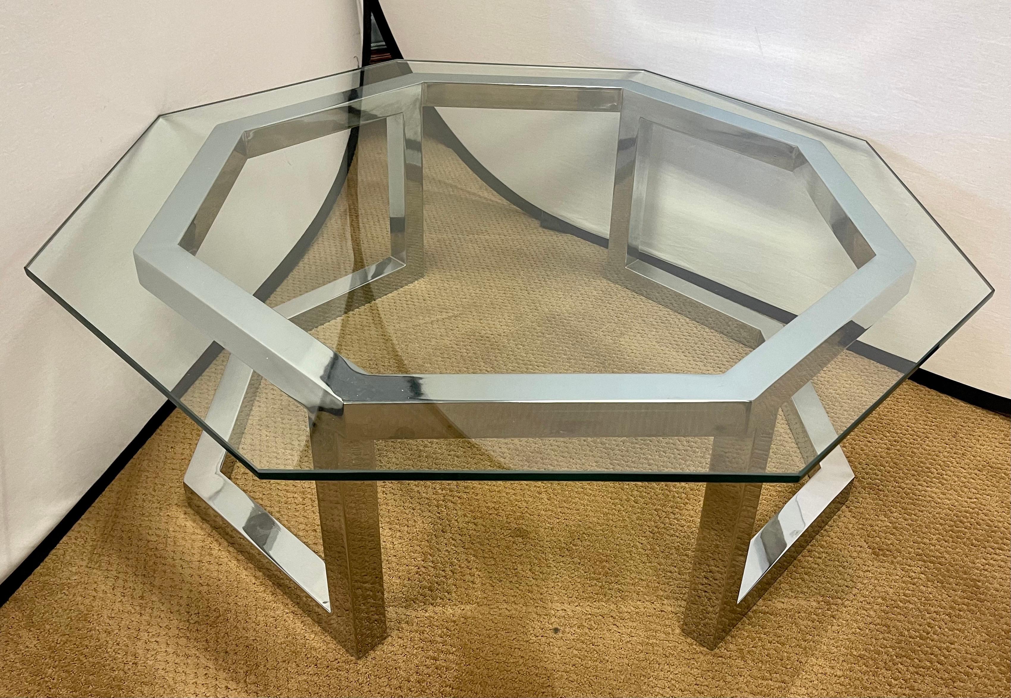 Magnificent Milo Baughman octagonal glass top with chrome base cocktail table.
Sculptural base opening at front and back - makes this piece look like a sculpture. Nothing short of gorgeous. Glass top is made of thick glass as one would expect.