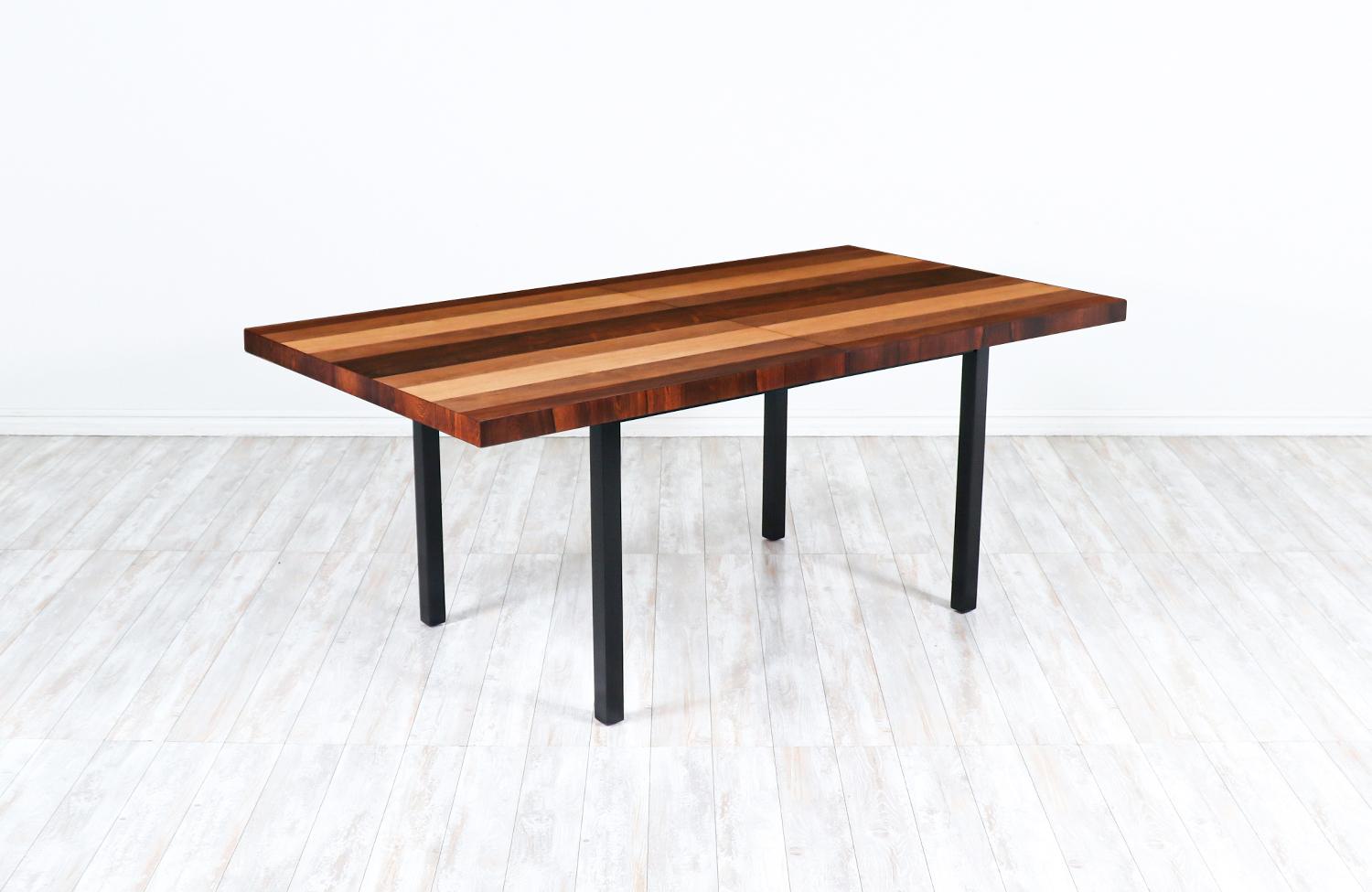 Milo Baughman Multi-Wood Expanding dining table for Directional 

Dimensions
29.50in H x 72in-112in W x 39in D 
2x Leaves - 20in Each.