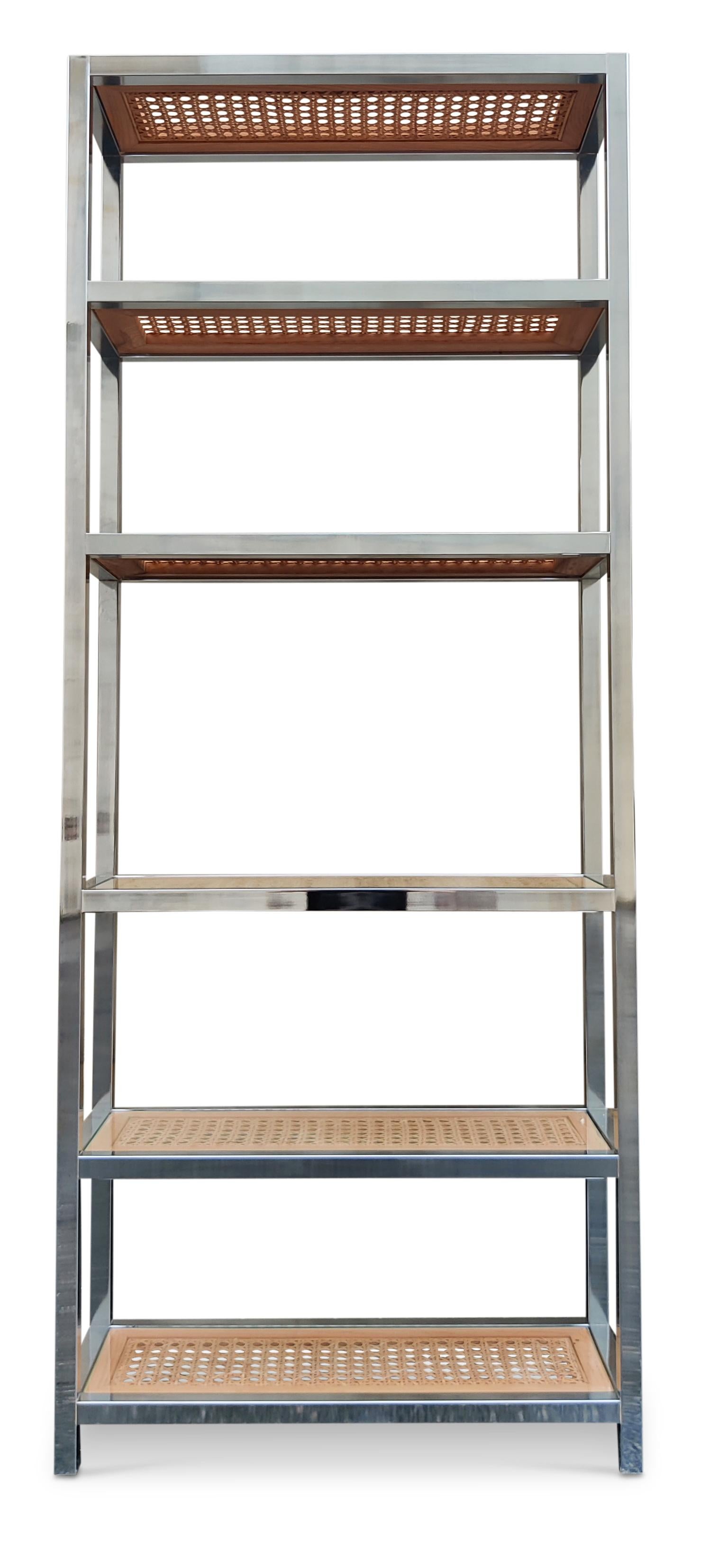 This tall, narrow, and elegant etagere was designed in the 1980s in the style of Gabriella Crespi or Milo Baughman, who is famous in part for his iconic etagere designs. This exmaple is made of 1 1/4 inch thick chromed steel for the frame and has 6