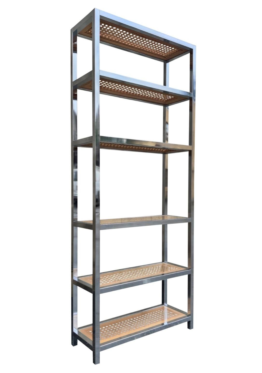This tall, narrow, and elegant etagere was designed in the 1980s in the style of Gabriella Crespi or Milo Baughman, who is famous in part for his iconic etagere designs. This example is made of 1 1/4 inch thick chromed steel for the frame and has 6