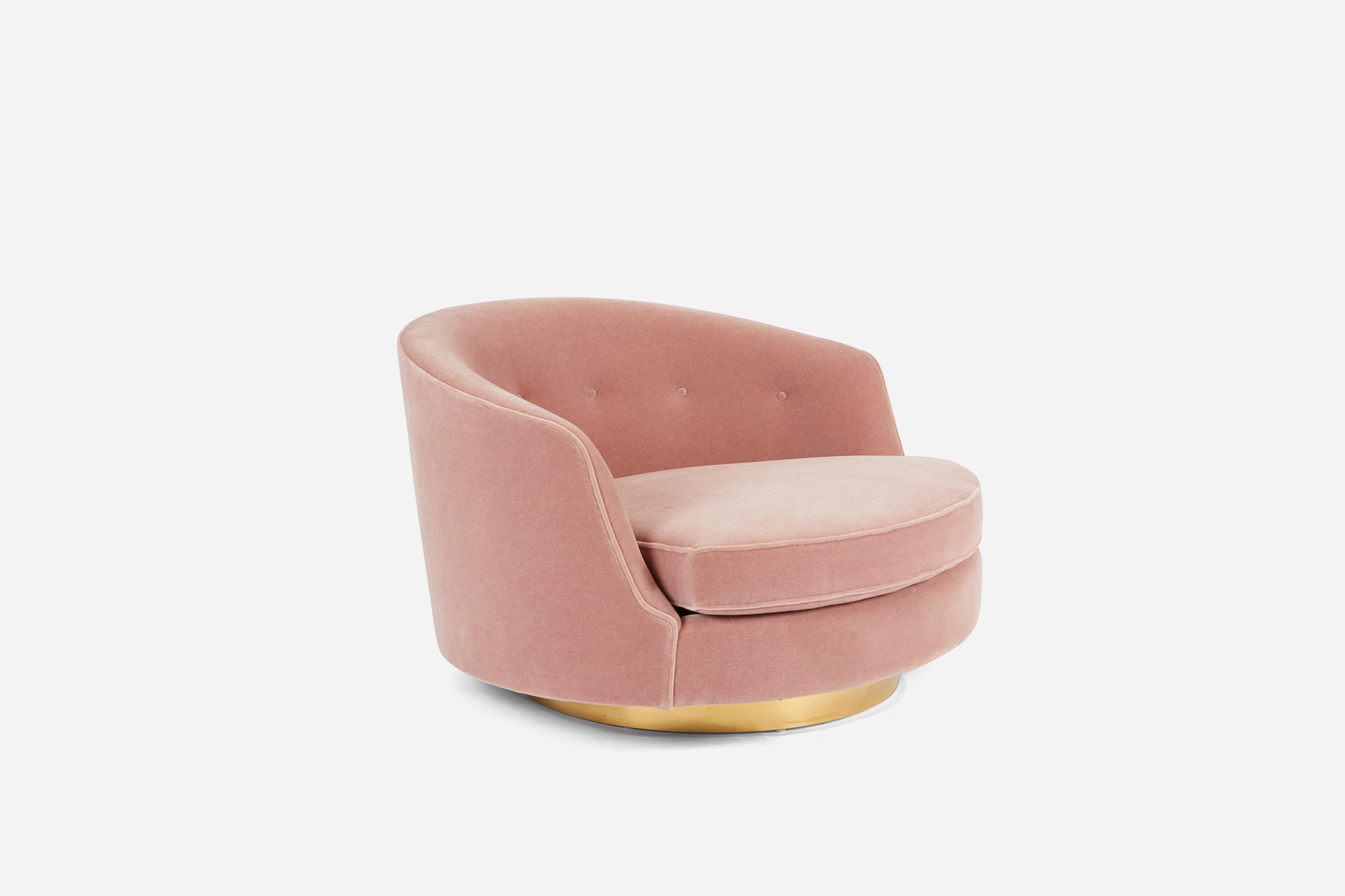 Large-scale swivel chair by Milo Baughman. Fully restored. Reupholstered in dusty pink mohair over swivelling brass base. Base has fresh new raw brass finish, a living finish that will patina with age.