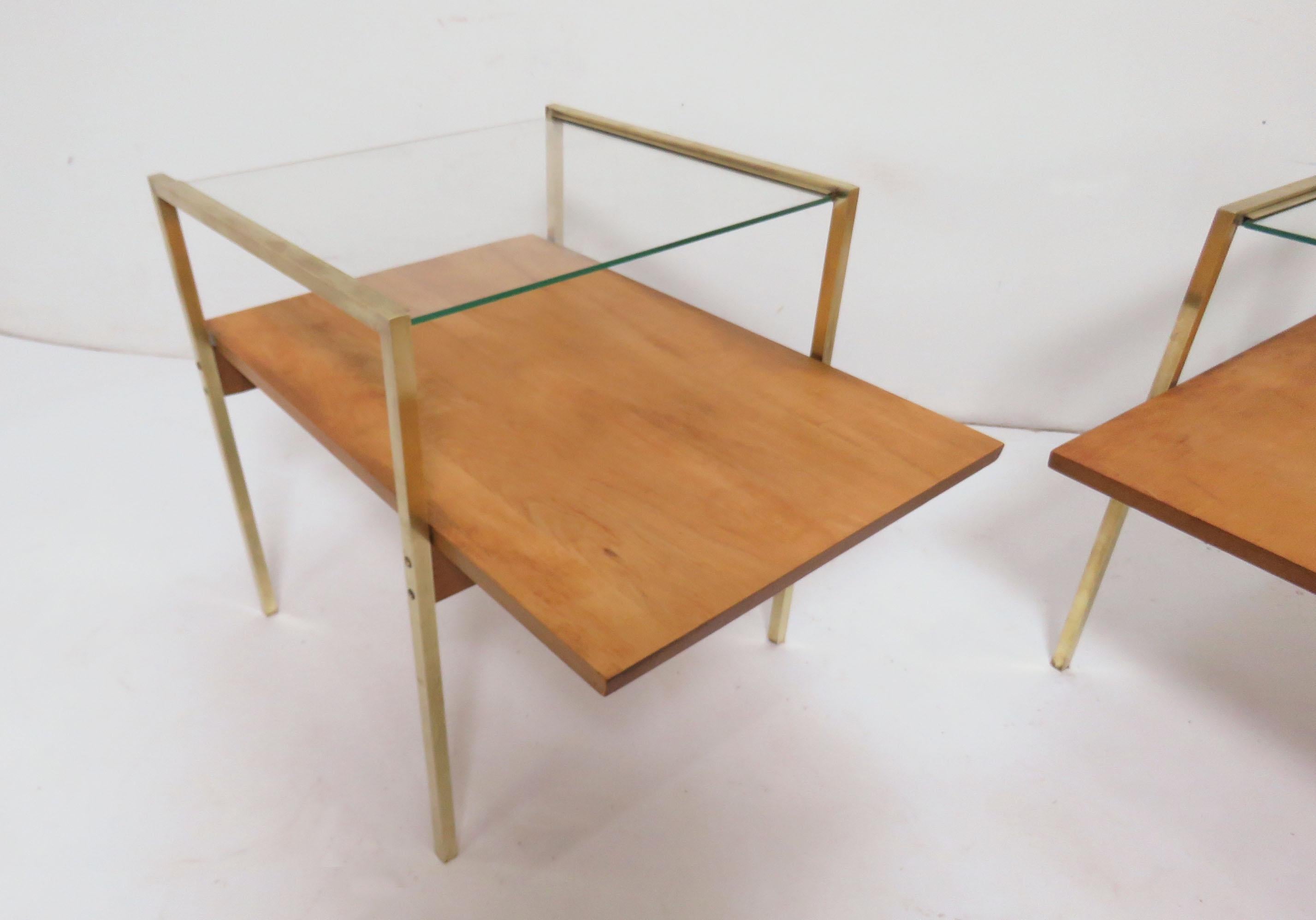 A uniquely rare pair of side tables we’ve attributed to Murray Furniture of Winchendon, Mass., from their early 1950s “Milo Baughman Collection”. Although previously undocumented, the brass channeling, support screws and multiple features of their