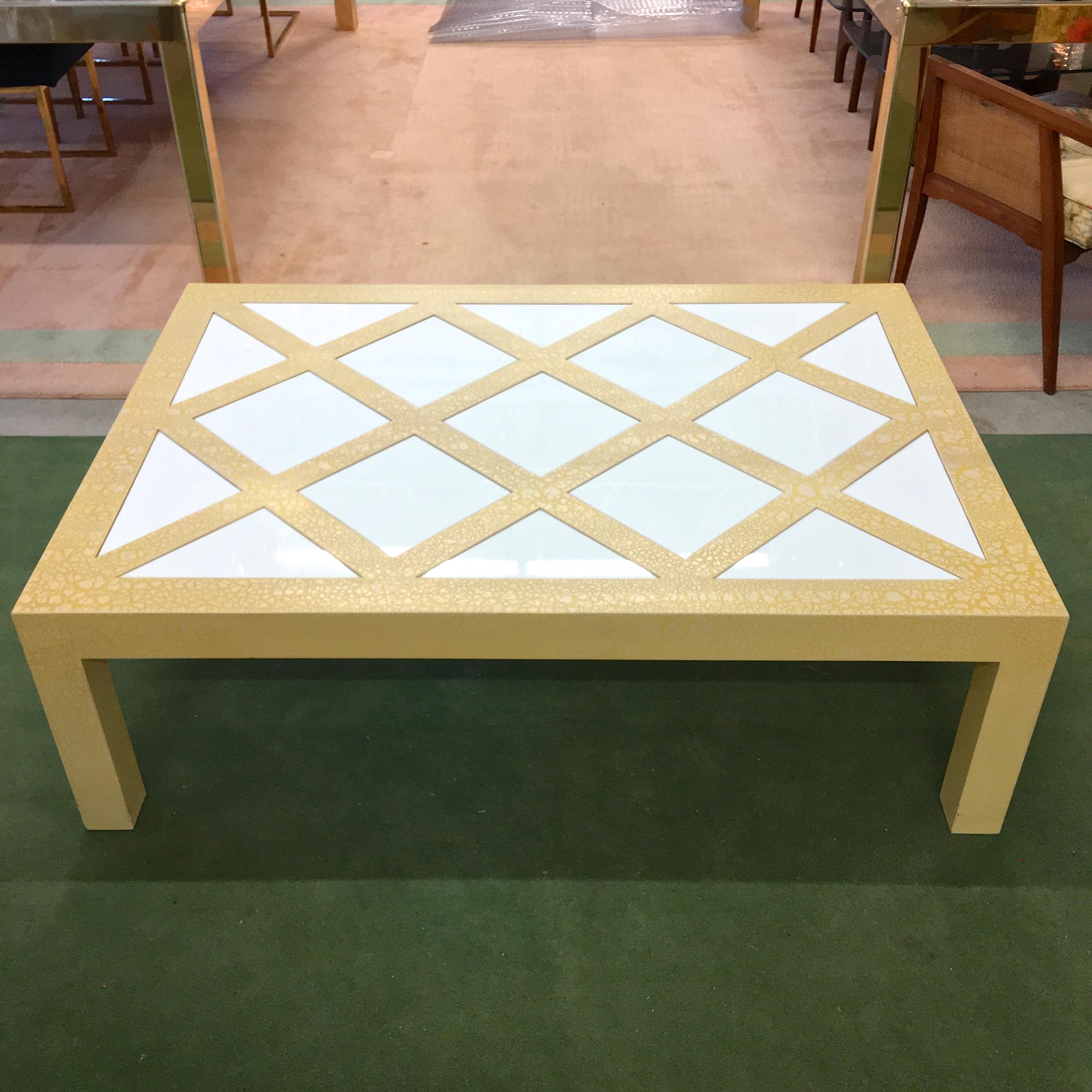 Milo Baughman Style, circa 1972 rectangular parsons cocktail table in yellow crackled finish with inset white Vitrolite glass parquetry tiles, square and triangle, forming a checkered trellis pattern.