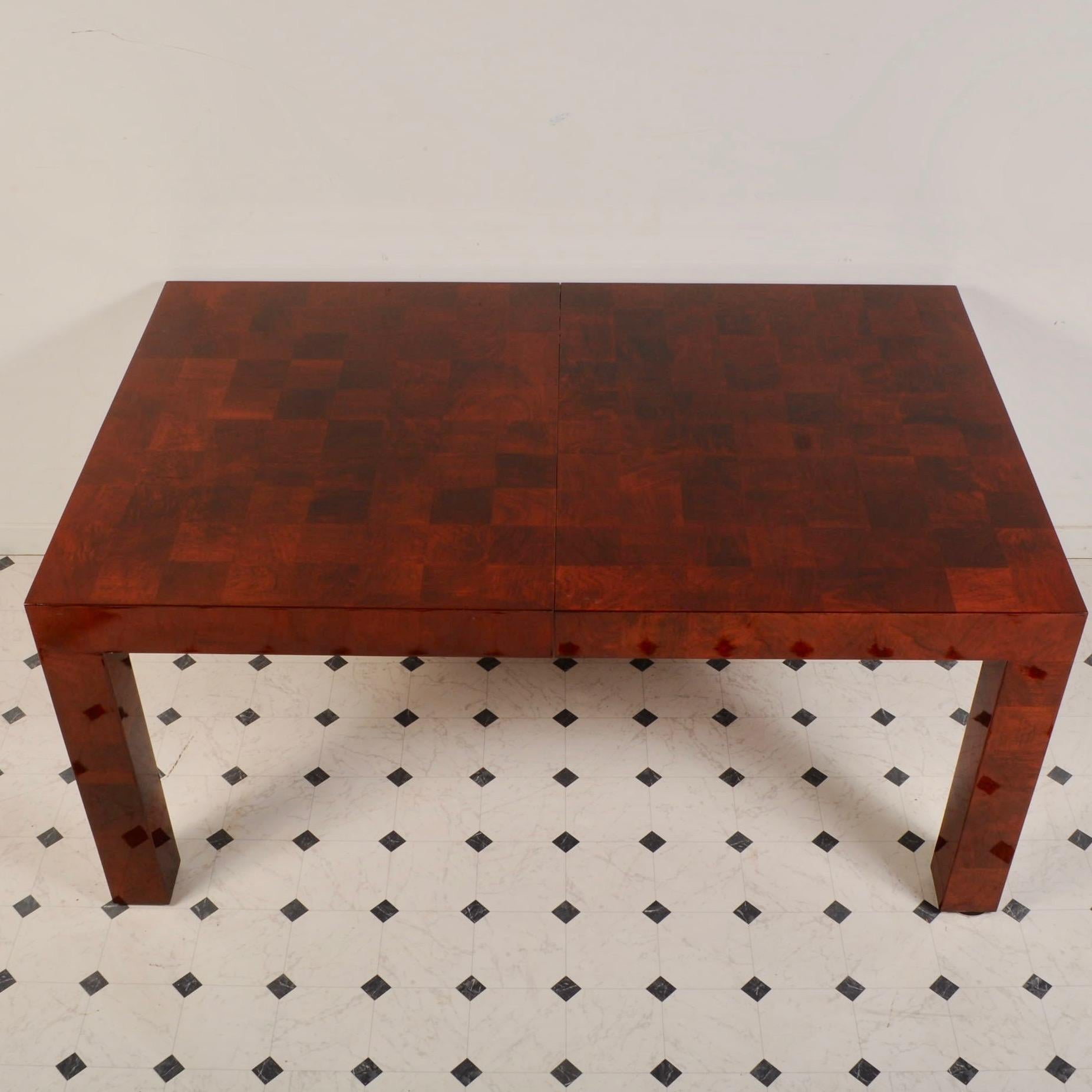 Professionally refinished to a high gloss, this 1970s era dining table is ready to host dinners for another 40+ years. Includes one 20
