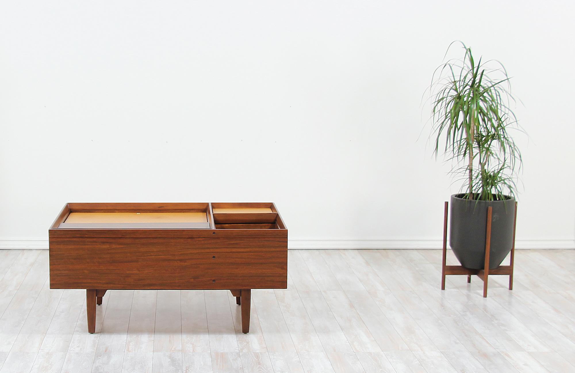 Mid-Century Modern coffee table designed by Milo Baughman for Drexel’s “Perspective” collection in the United States circa 1950s. This iconic design is comprised of a solid Philippines Mindoro wood case sitting on four sleek tapered legs with a