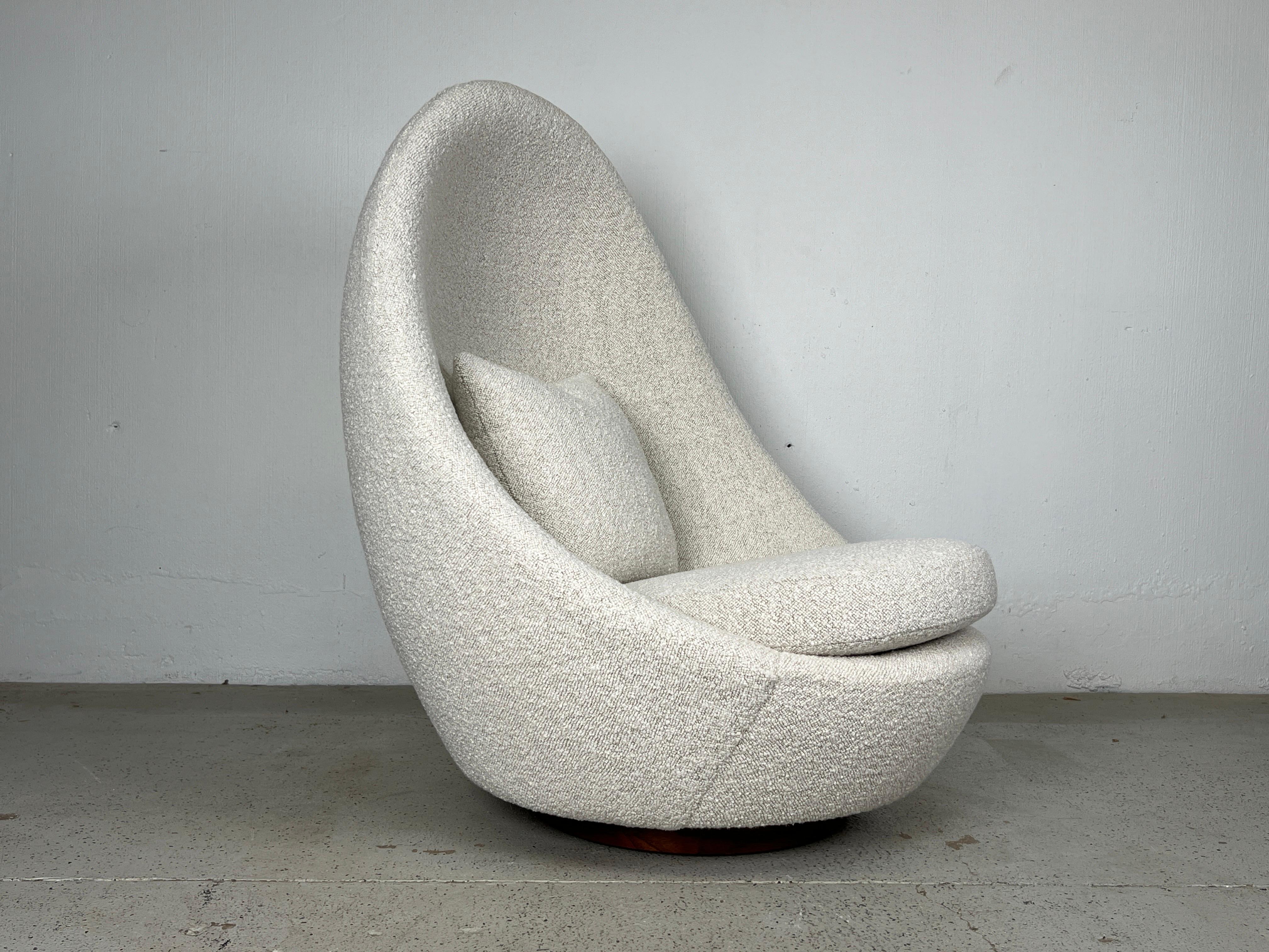 A high back rocking egg chair designed by Milo Baughman for Thayer Coggin. Reupholstered and refinished. 