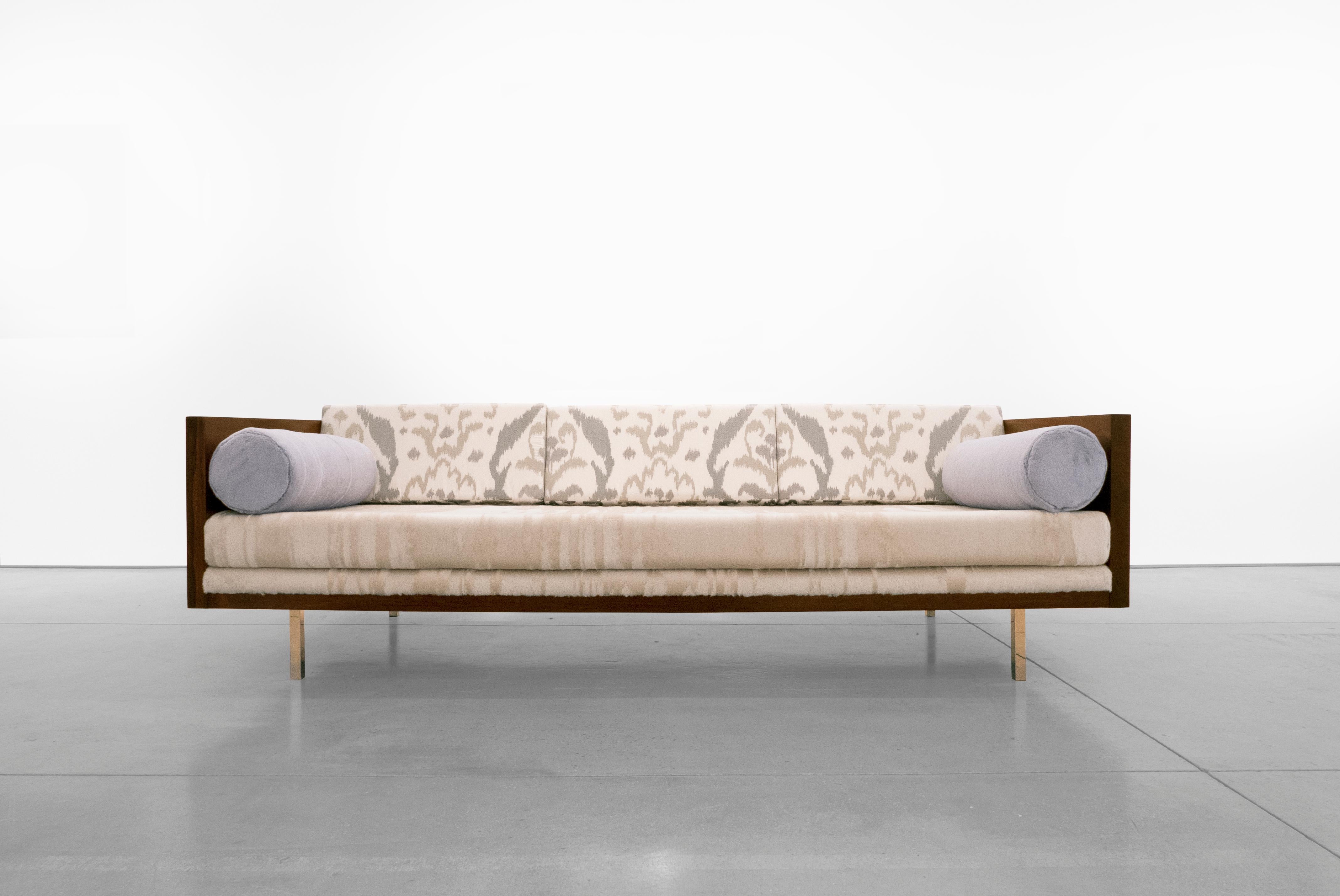 Wrapped rosewood three-seat sofa. Meticulously reupholstered with Dedar Milano fabrics, designed by Milo Baughman in the 1950s.

Milo Baughman brought comfort and ease to the simplicity and functionality of modern furniture. “Furniture that is too