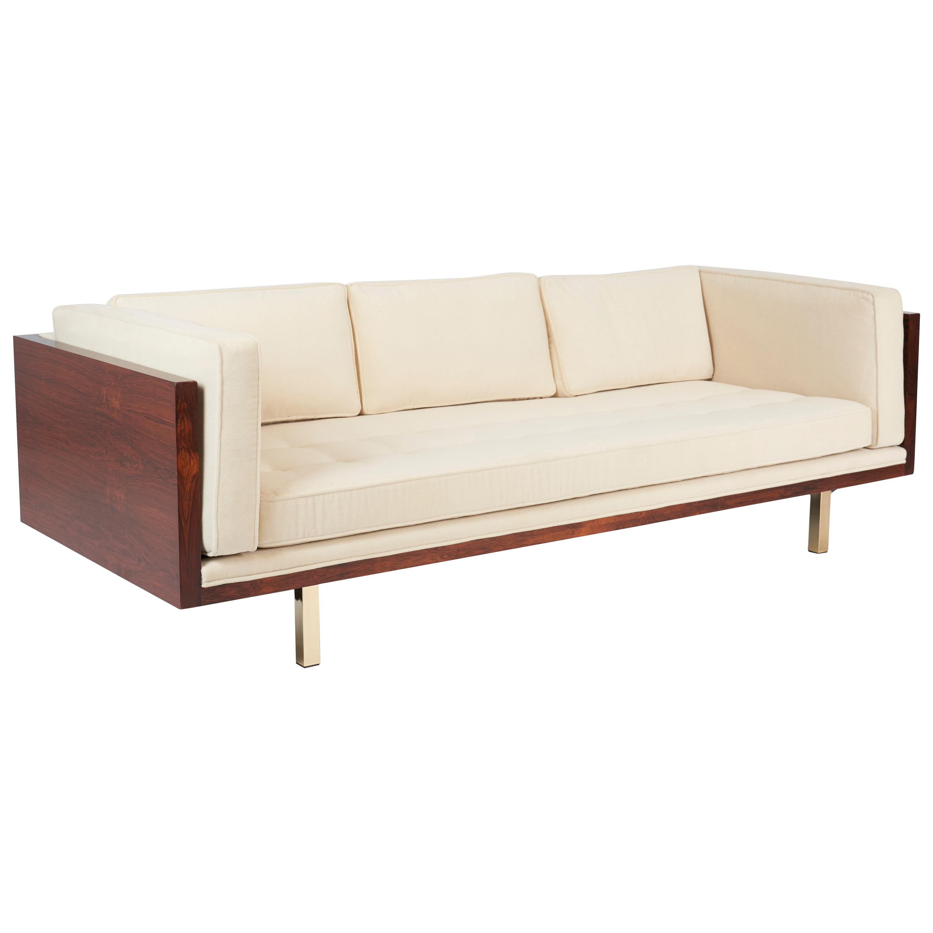 Rosewood case sofa by Milo Baughman for Thayer Coggin. Fully restored figural rosewood case with new foam, feathers and mohair upholstery. Original rosewood legs replaced with brass. Model #2165.