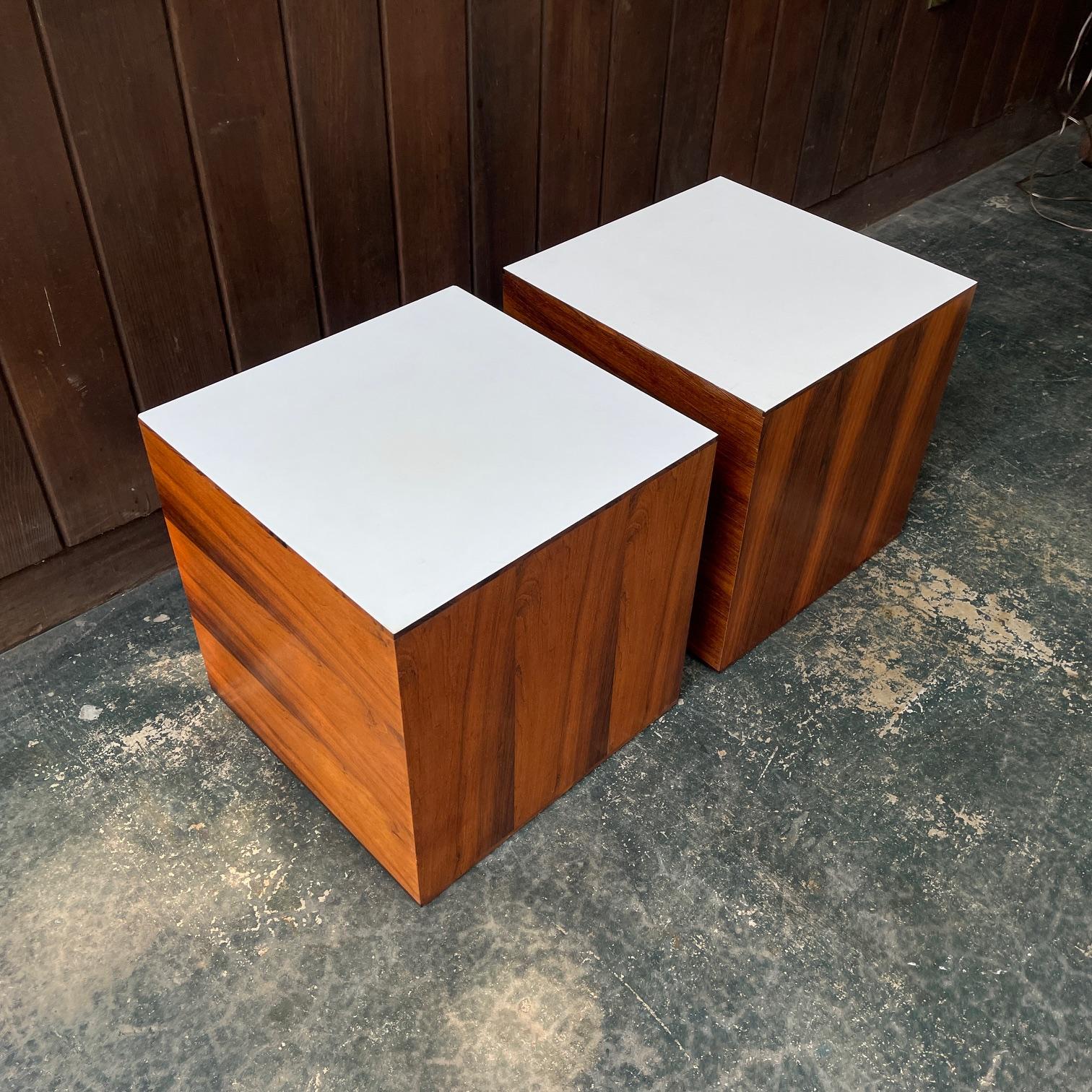 Pair.
Classic pairing of white and rosewood, super  60s-70s mcm style! Really nicely made pieces, very heavy, one has hard white formica, the other has a white slightly textured surface, the difference is not very noticeable.  Otherwise these are a