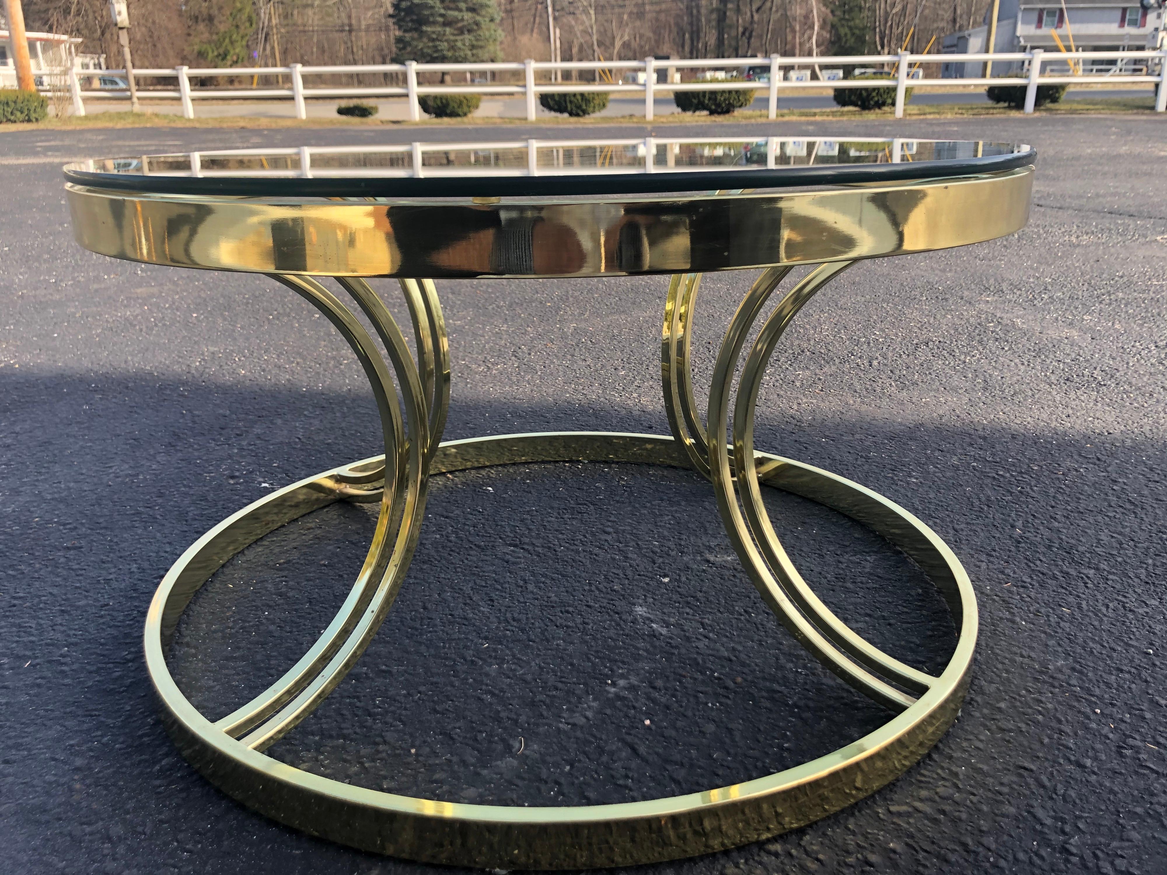 Milo Baughman round brass and glass coffee or side table. Classic Hollywood regency style with a mid century flair. Perfect for that 1970's-1980's style. Tres chic!