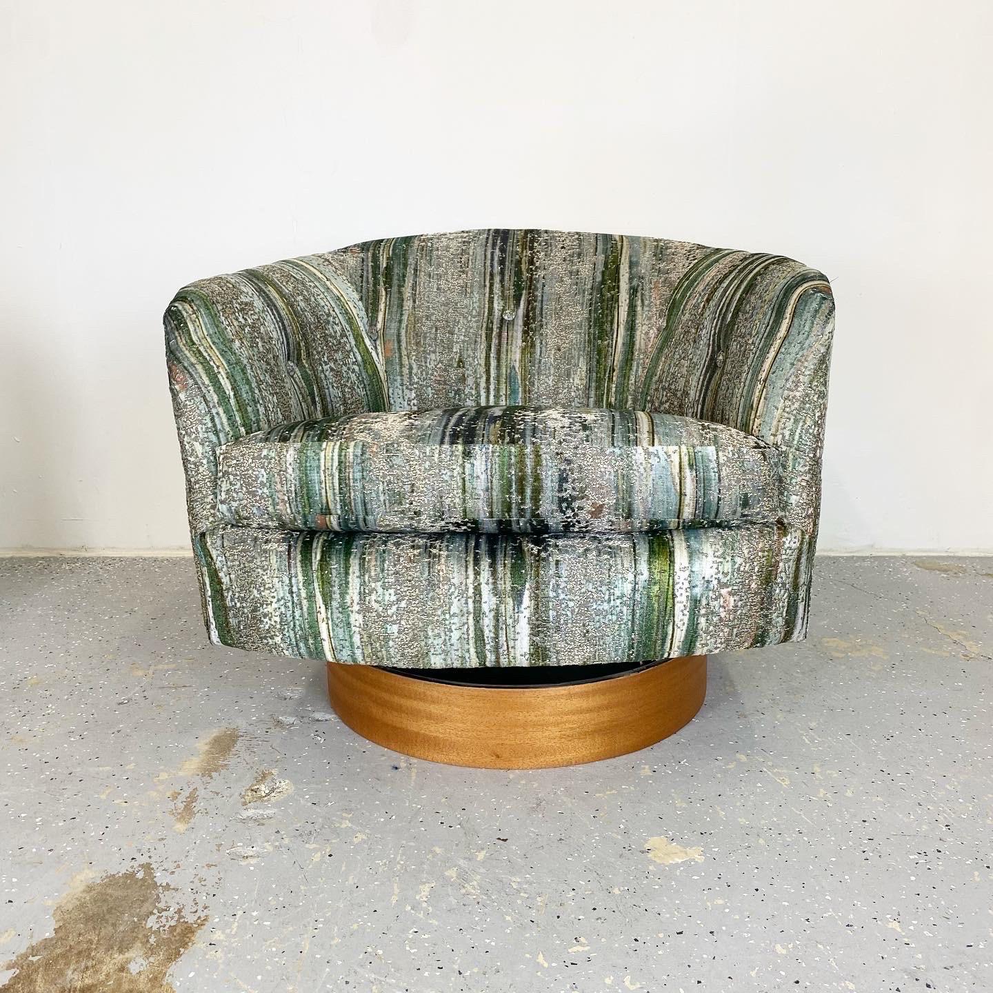 Vintage swivel/rockers by Thayer Coggin designed by Milo Baughman. These lounge chairs offer comfort and versatility in a small footprint. Newly upholstered S. Harris Brushstroke velvet with newly restored mahogany bases.