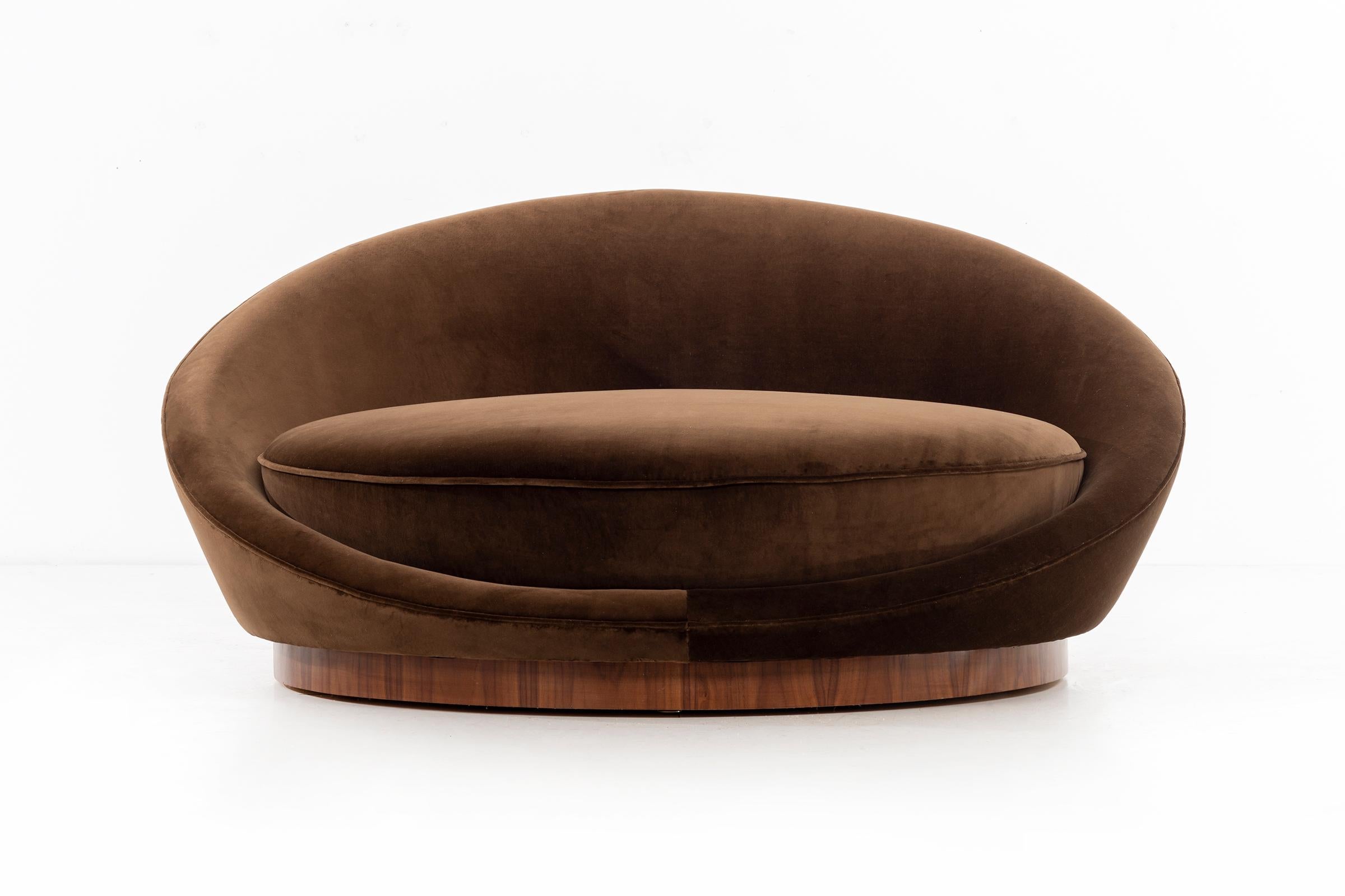 Oversized chaise lounge chair for 1-2 users. Upholstered in cotton velvet and walnut plinth base.