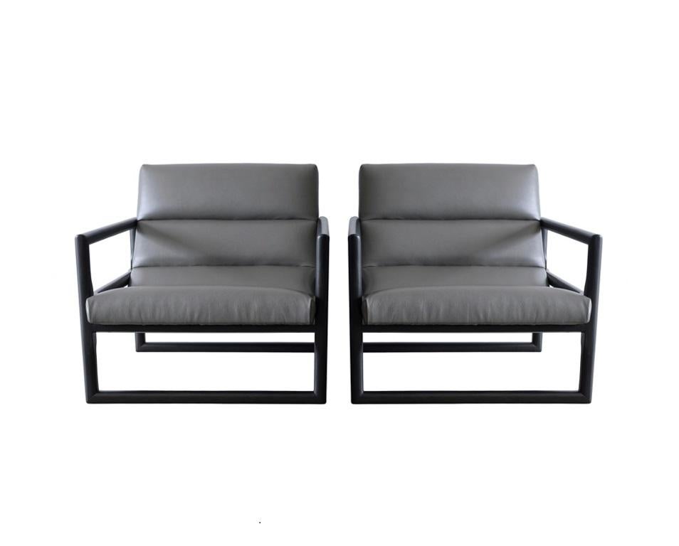 Spectacular pair of vintage oversized 'Scoop' lounge chairs by Milo Baughman for Thayer Coggin, circa 1950s. Substantial solid wood frame’s geometric lines are softened by cylindrical supports. In the more visually interesting configuration that