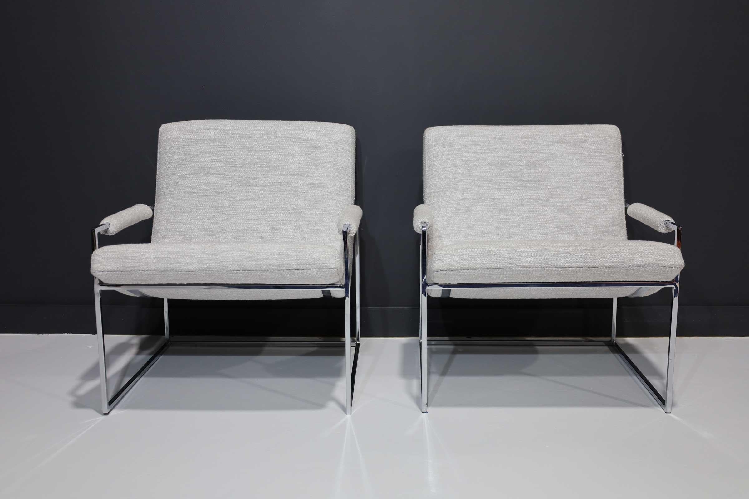 A great looking pair of scoop lounge chairs by Milo Baughman. Newly upholstered in a Holly Hunt performance weave.
    