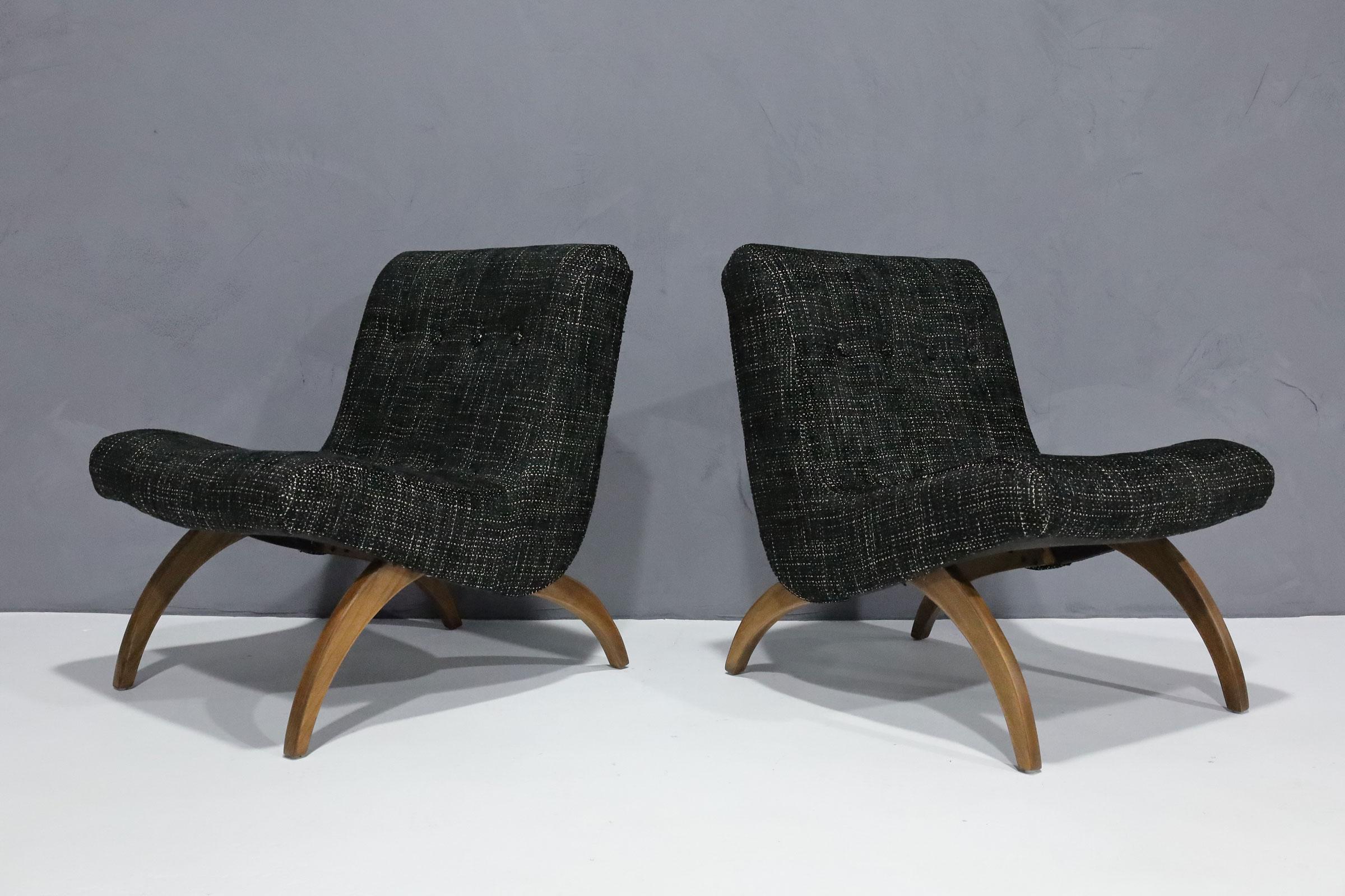 We have reupholstered and refinished these scoop chairs designed by Milo Baughman. Great lines and very comfortable. Chairs are sturdy and look great in a handsome black with cream weave. Stamped April 1958.