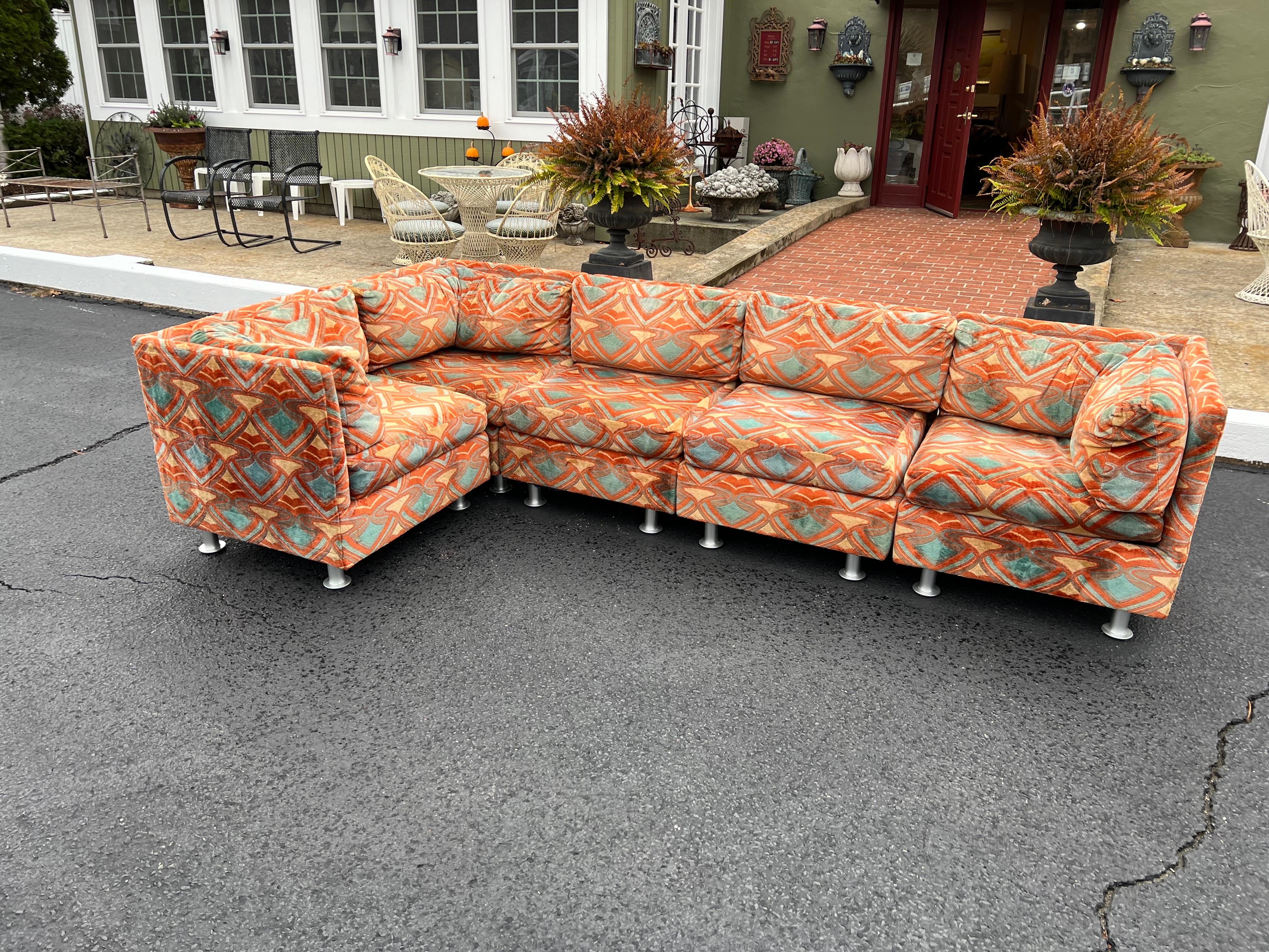 Colorful Milo Baughman sofa in original Upholstery. Amazing condition for this one of a kind beauty. Tones of orange, turquoise and white. The thick custom fabric which is super durable. New aluminum legs were added to give it more height. We have