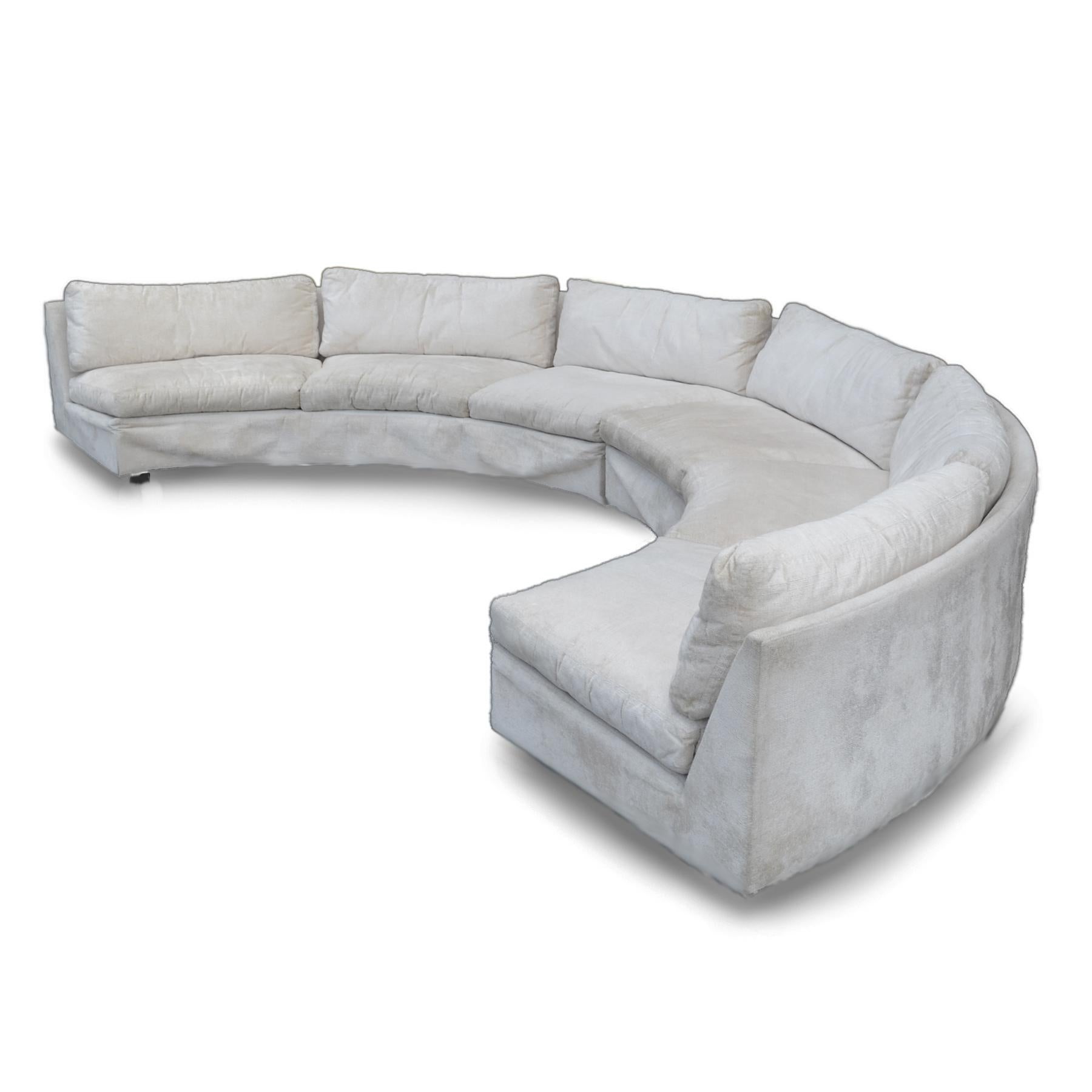 This big, sexy Baughman sofa is a two-piece, which when used together, form a semi-circular shape that is supported by square black legs. It's in good condition for its age, though the original upholstery could use some restoration. The original