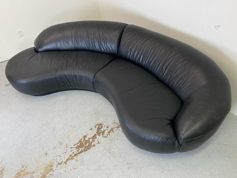 Biomorphic two piece sectional in black leather, Thayer Coggin.