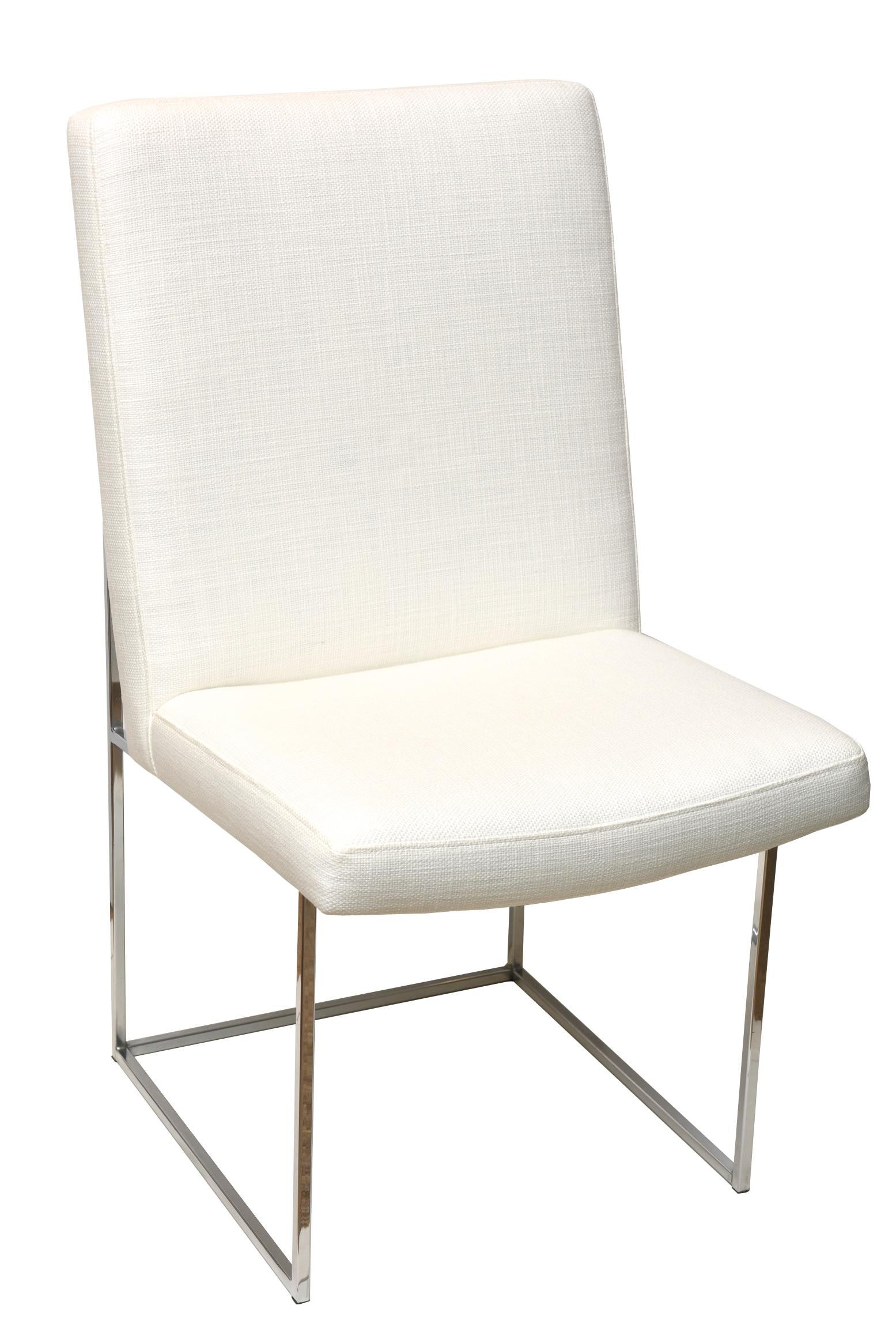 These set of 8 vintage Milo Baughman for Thayer Coggin architectural box frame dining chairs has all been re-upholstered and the floating chrome frames have all been polished to the best they can be. The new upholstery is in a textural white cotton