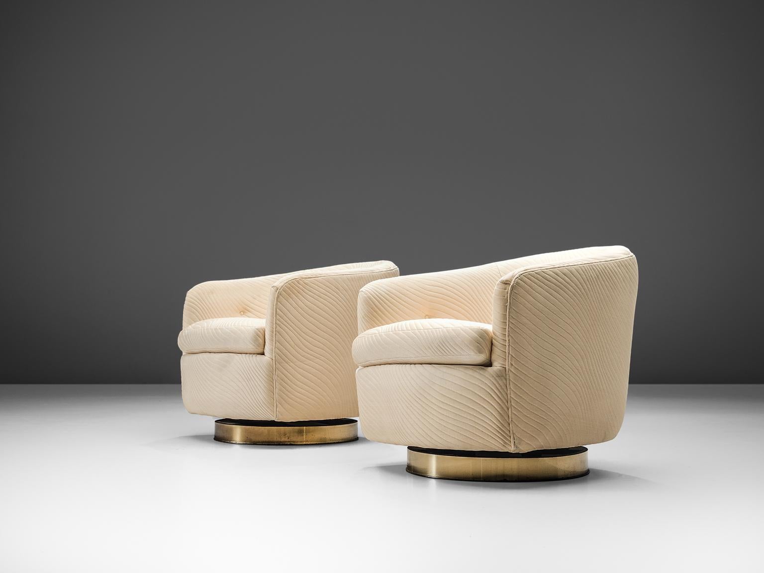 Milo Baughman for Thayer Coggin, set of two swivel chairs, in rippled fabric and brass, United States, 1960s. 

These lounge chairs which embrace the shape of the body, are very comfortable and easy to use, are a set which can be placed in the